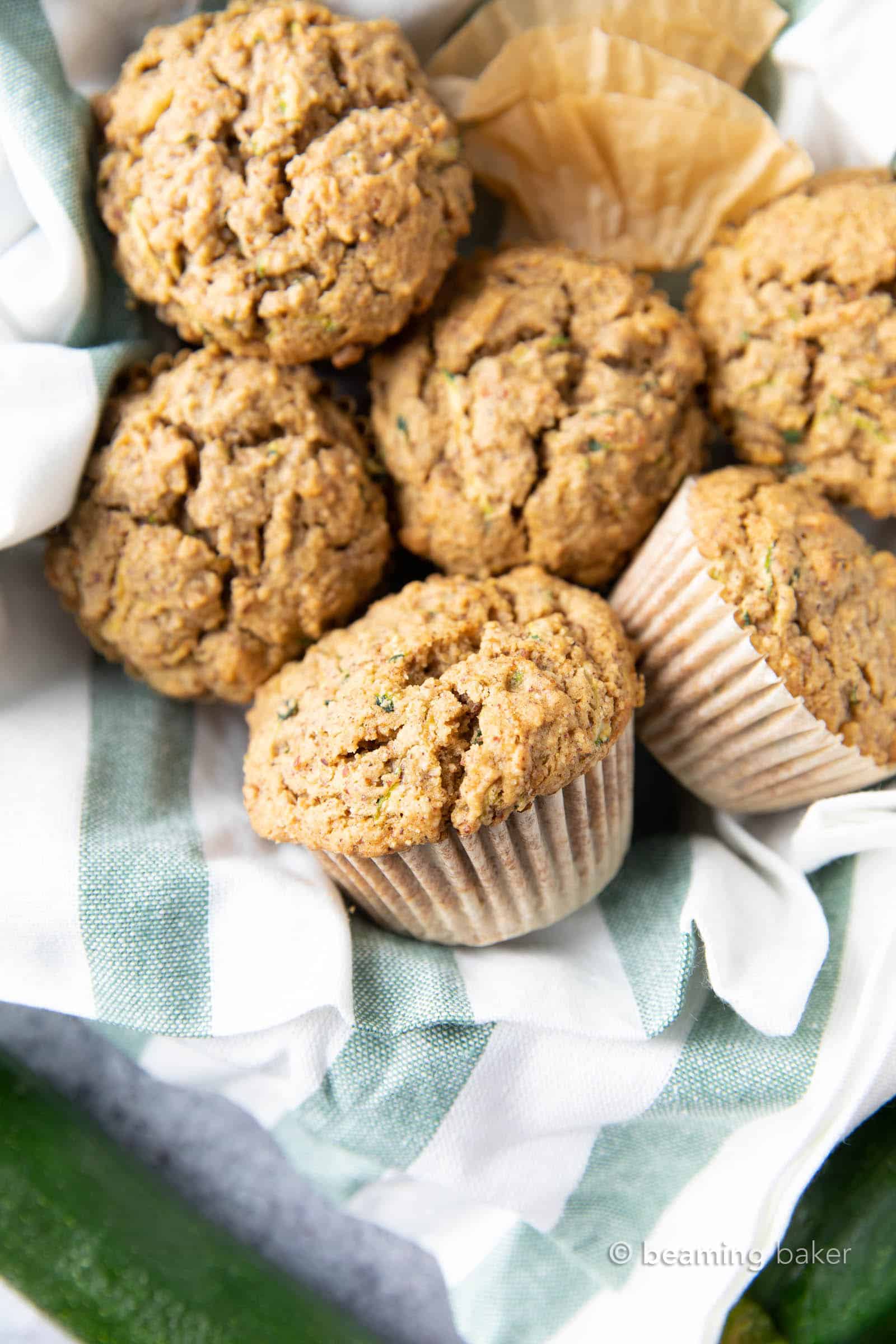 The Best Healthy Zucchini Muffins: Soft ‘n moist zucchini muffins that are buttery, perfectly sweet and made with healthy ingredients. The best zucchini muffin recipe! #Healthy #Zucchini #Muffins #Recipe | Recipe at BeamingBaker.com