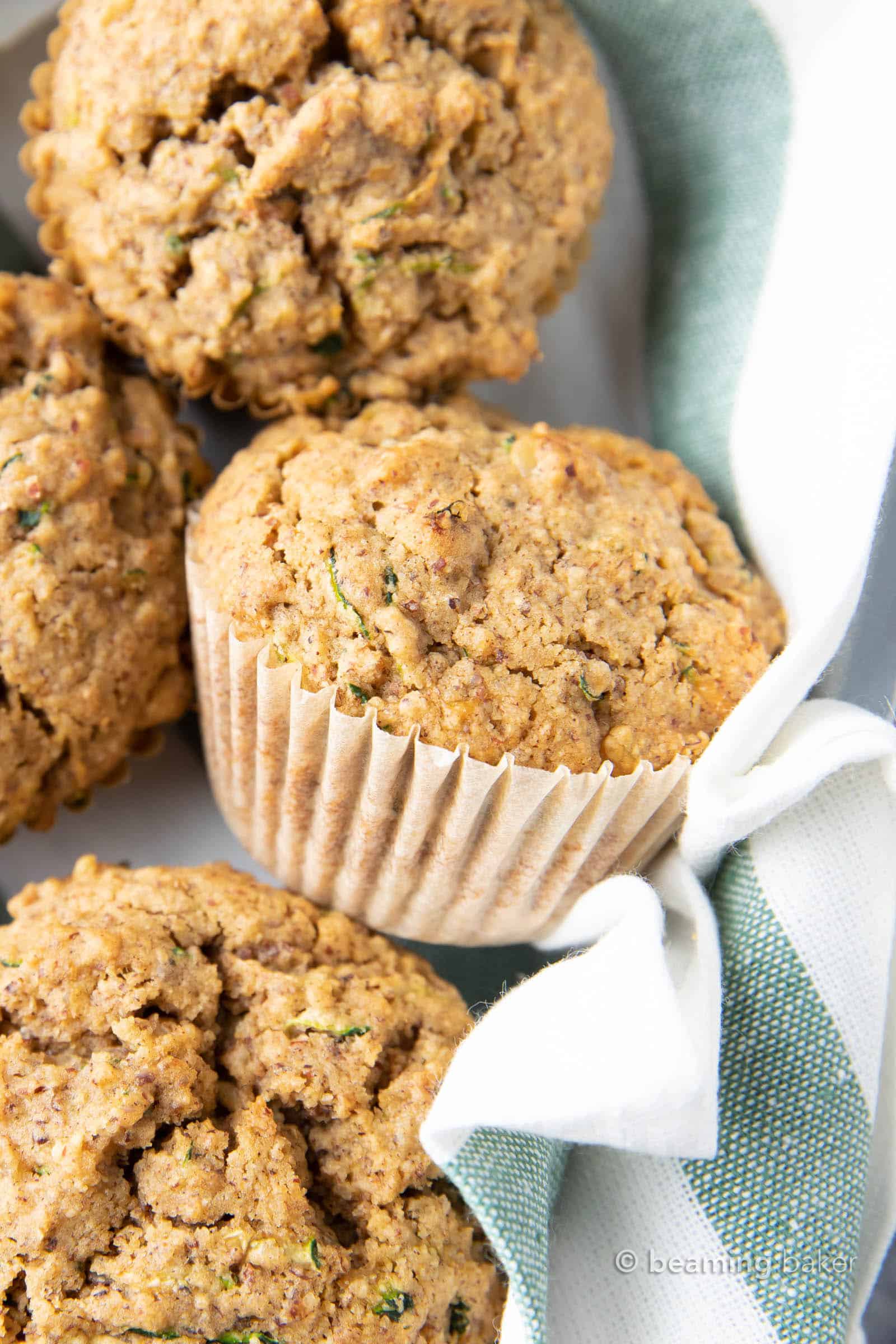 The Best Healthy Zucchini Muffins: Soft ‘n moist zucchini muffins that are buttery, perfectly sweet and made with healthy ingredients. The best zucchini muffin recipe! #Healthy #Zucchini #Muffins #Recipe | Recipe at BeamingBaker.com