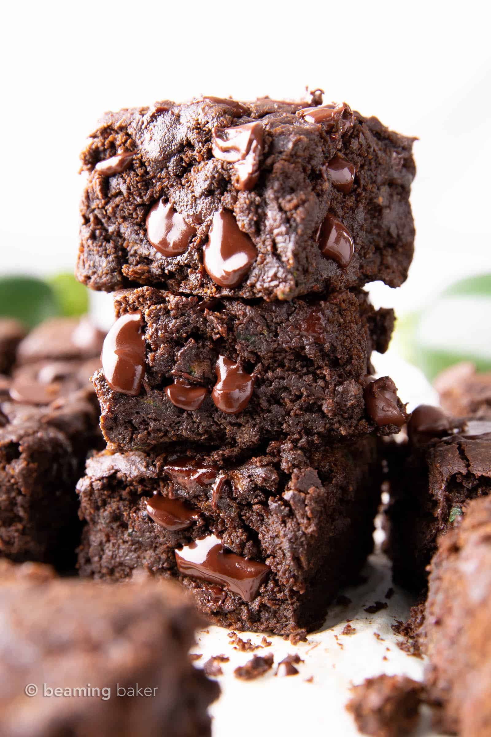 Healthy Zucchini Brownies (Vegan, GF): this chocolate zucchini brownies recipe yields moist, tender cakey brownies with rich chocolate flavor & a lightly fudgy texture. Vegan, Healthy. #Zucchini #ZucchiniBrownies #HealthyDesserts #Healthy #Vegan | Recipe at BeamingBaker.com