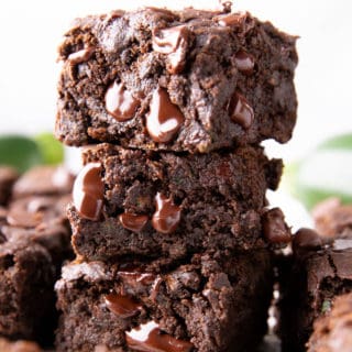 Healthy Zucchini Brownies (Vegan, GF): this chocolate zucchini brownies recipe yields moist, tender cakey brownies with rich chocolate flavor & a lightly fudgy texture. Vegan, Healthy. #Zucchini #ZucchiniBrownies #HealthyDesserts #Healthy #Vegan | Recipe at BeamingBaker.com
