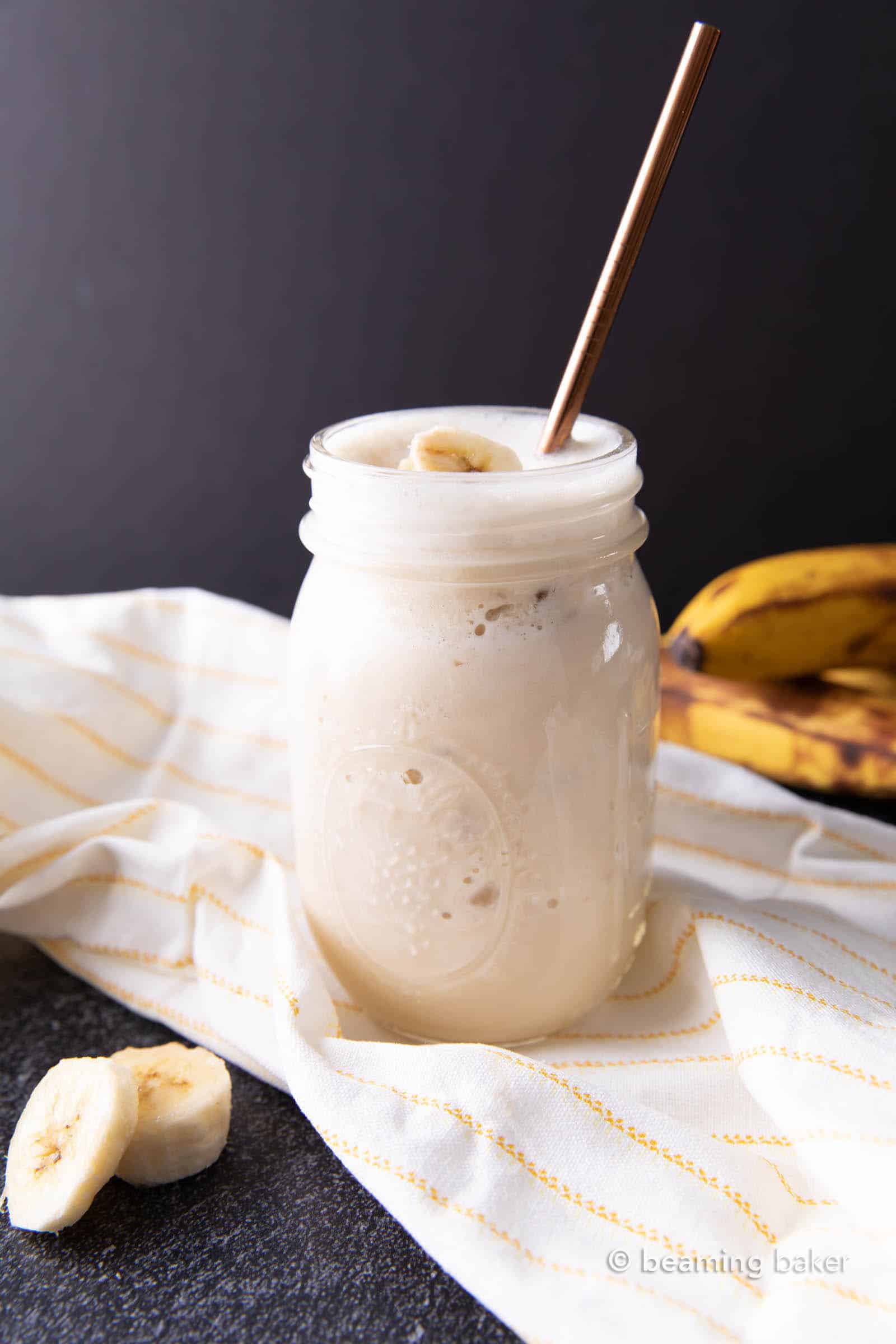 Banana Protein Shake: this 4 ingredient banana protein shake recipe is homemade, easy & delicious! The best banana protein shake—23g of protein per serving, vegan, plant-based, dairy-free. #ProteinShake #Banana #Smoothie #Vegan | Recipe at BeamingBaker.com