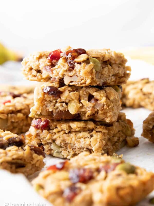 stack of three healthy breakfast bars surrounded by more bars.