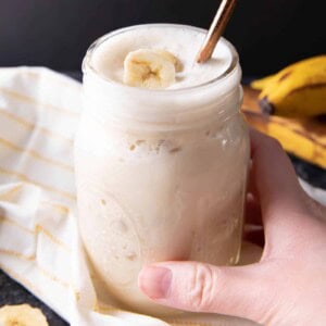 Banana Protein Shake: this 4 ingredient banana protein shake recipe is homemade, easy & delicious! The best banana protein shake—23g of protein per serving, vegan, plant-based, dairy-free. #ProteinShake #Banana #Smoothie #Vegan | Recipe at BeamingBaker.com