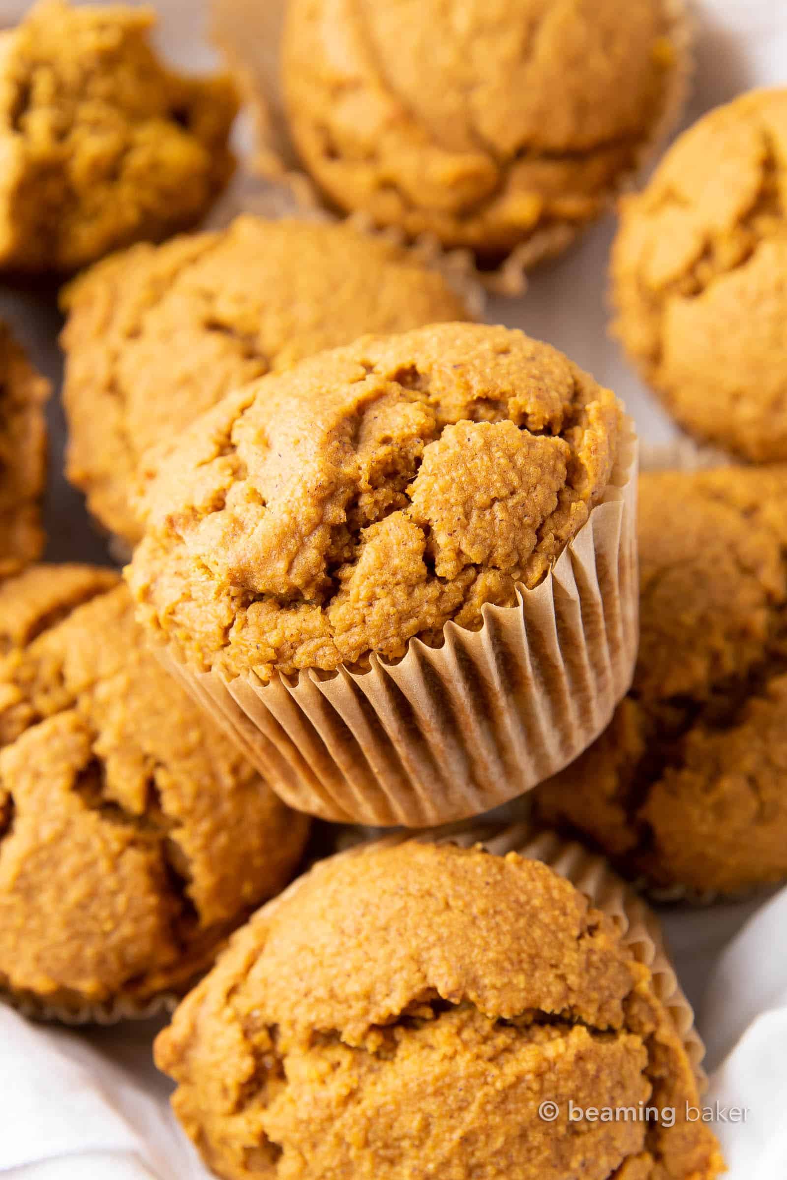 Vegan Pumpkin Muffins: this vegan pumpkin muffin recipe is easy & eggless! The best vegan pumpkin muffins – moist, soft & tender crumb, perfectly spiced. #Vegan #Pumpkin #Muffins #Fall | Recipe at BeamingBaker.com