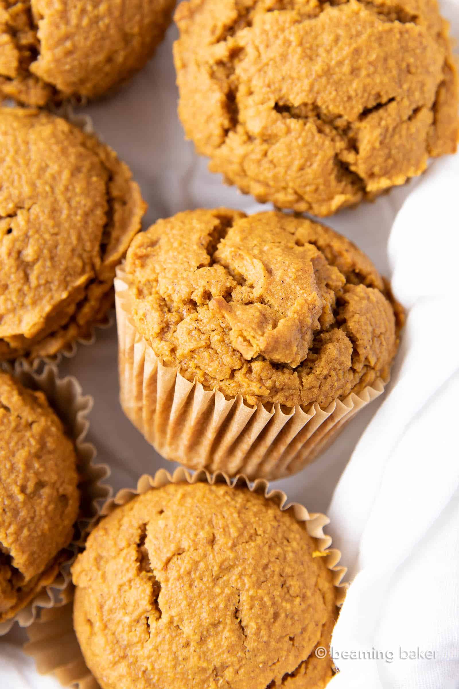 Vegan Pumpkin Muffins: this vegan pumpkin muffin recipe is easy & eggless! The best vegan pumpkin muffins – moist, soft & tender crumb, perfectly spiced. #Vegan #Pumpkin #Muffins #Fall | Recipe at BeamingBaker.com