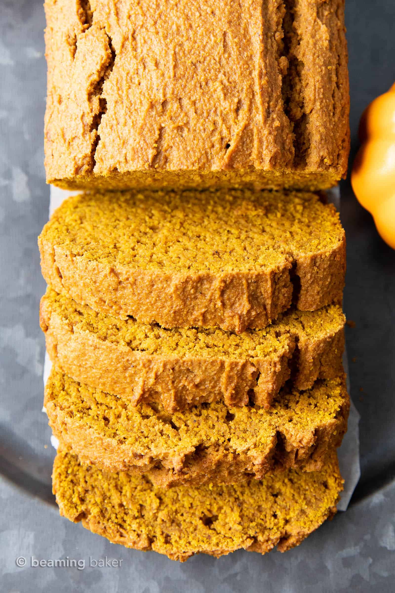 Easy Vegan Pumpkin Bread: this vegan pumpkin bread recipe is moist, deliciously dense & lightly fluffy, with rich pumpkin flavor. The best vegan pumpkin bread! #Vegan #Pumpkin #Bread #Easy | Recipe at BeamingBaker.com