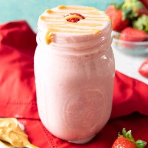 Strawberry Peanut Butter Protein Shake Recipe: this PB&J protein shake recipe is packed with 16 grams of protein! The best protein shake—4 ingredients, vegan, dairy-free, no added sugar & healthy! #Protein #Shake #Strawberry #PeanutButter | Recipe at BeamingBaker.com