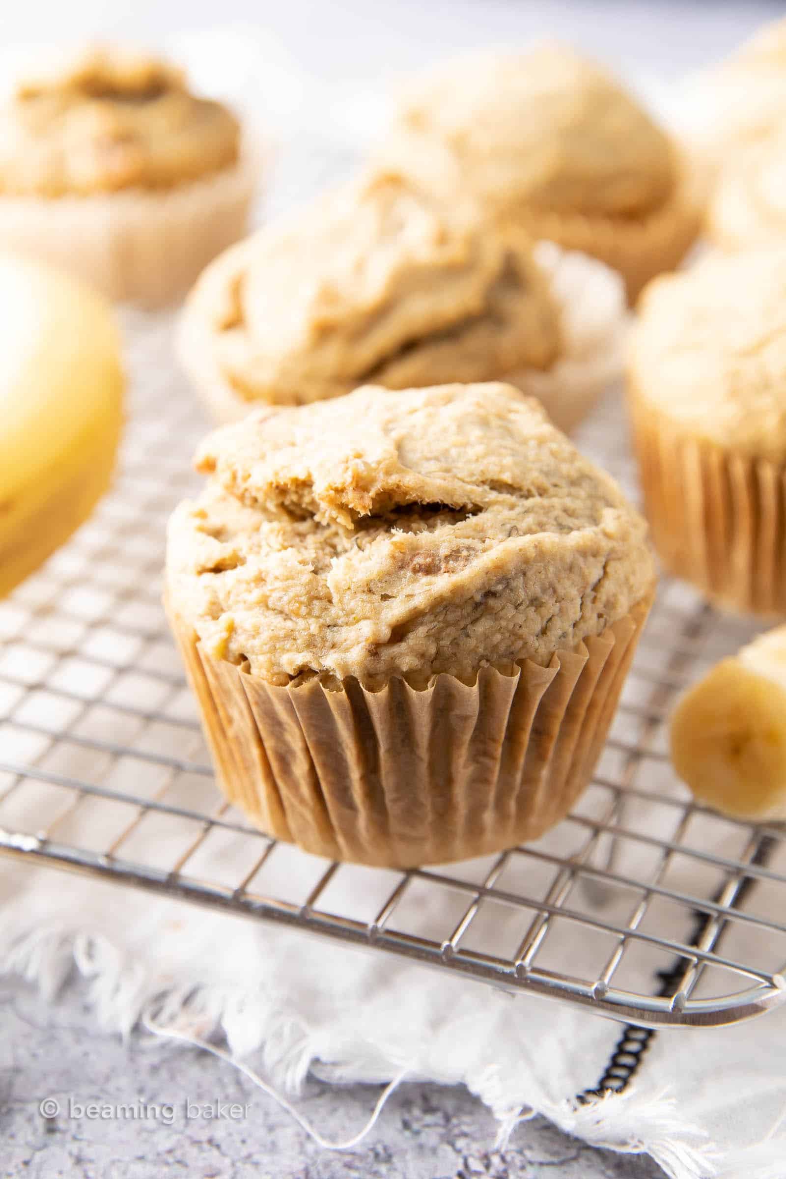 An easy recipe for Gluten Free Banana Muffins that are satisfyingly dense and rich, with just a bit of fluffiness and delicious medium sweet banana flavor. #GlutenFree #Banana #Muffins | Recipe at BeamingBaker.com 