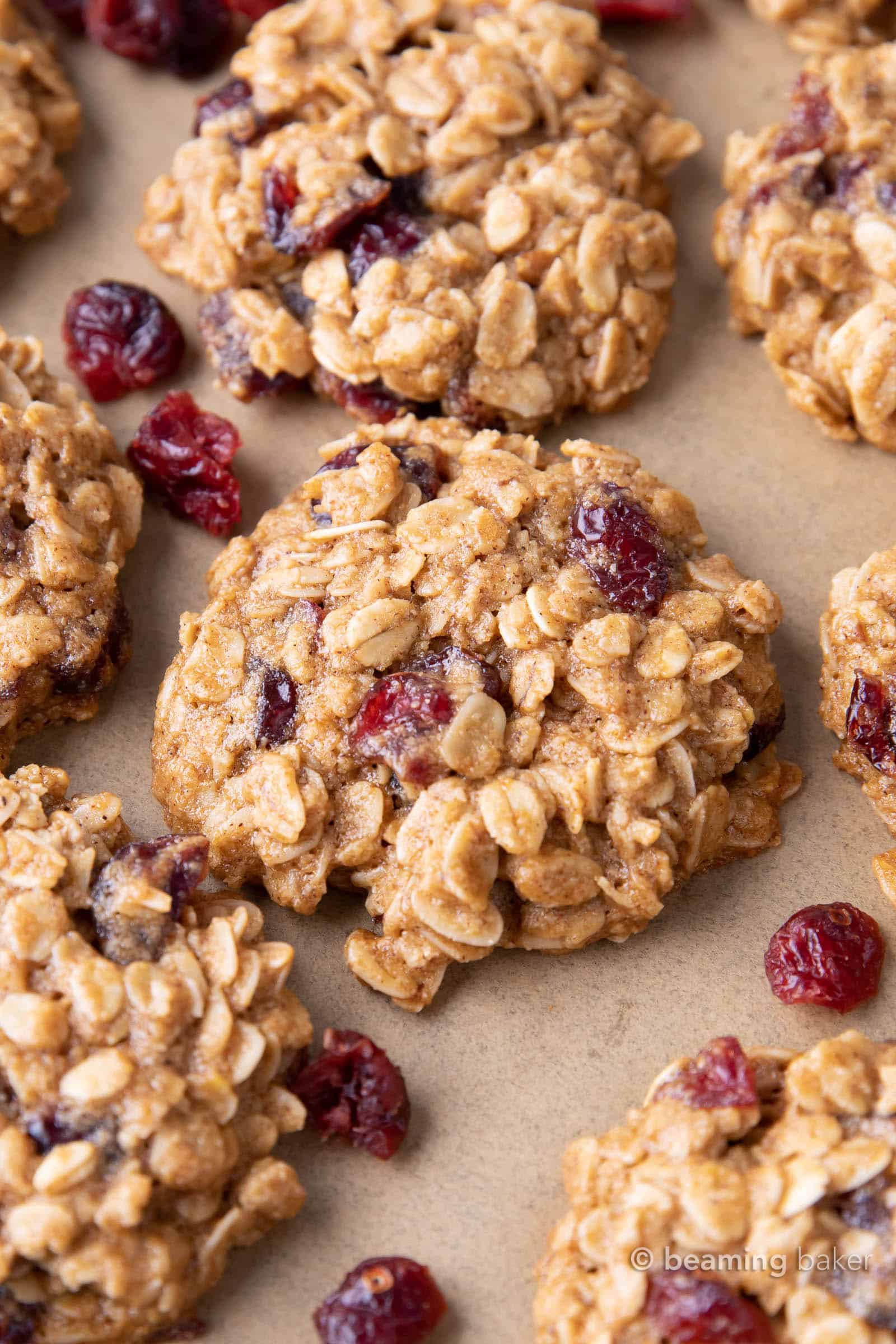 Healthy Oatmeal Cranberry Cookies: warm, cozy spices with chewy oats and sweet ‘n tart cranberries in the best vegan oatmeal cranberry cookies recipe! #Vegan #Healthy #Oatmeal #Cranberry #Cookies | Recipe at BeamingBaker.com