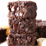 Vegan Banana Brownies: thick squares of super moist chocolate banana brownies. Melt-in-your-mouth fudgy and rich with a soft, tender crumb. The best banana brownie recipe! GF. #Vegan #Banana #Brownies #BananaBrownies | Recipe at BeamingBaker.com