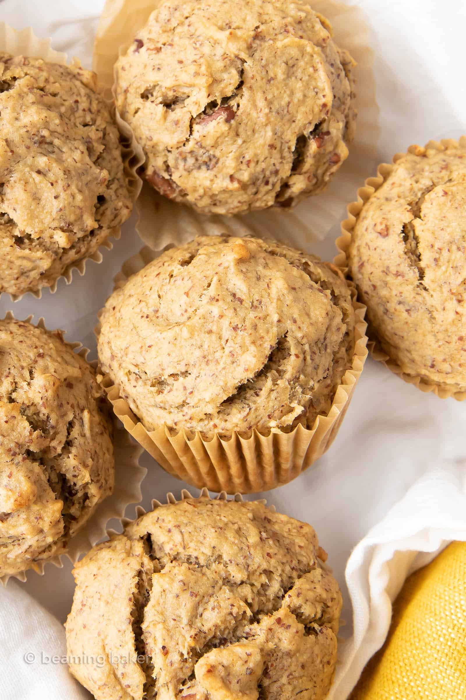 Healthy Banana Muffins Recipe: the BEST healthy banana muffins—secretly healthy, soft ‘n dense banana bread-style muffins with lightly sweet, comforting banana flavor. Made with healthy, whole ingredients. #HealthyMuffins #Banana #Muffins #BananaMuffins | Recipe at BeamingBaker.com