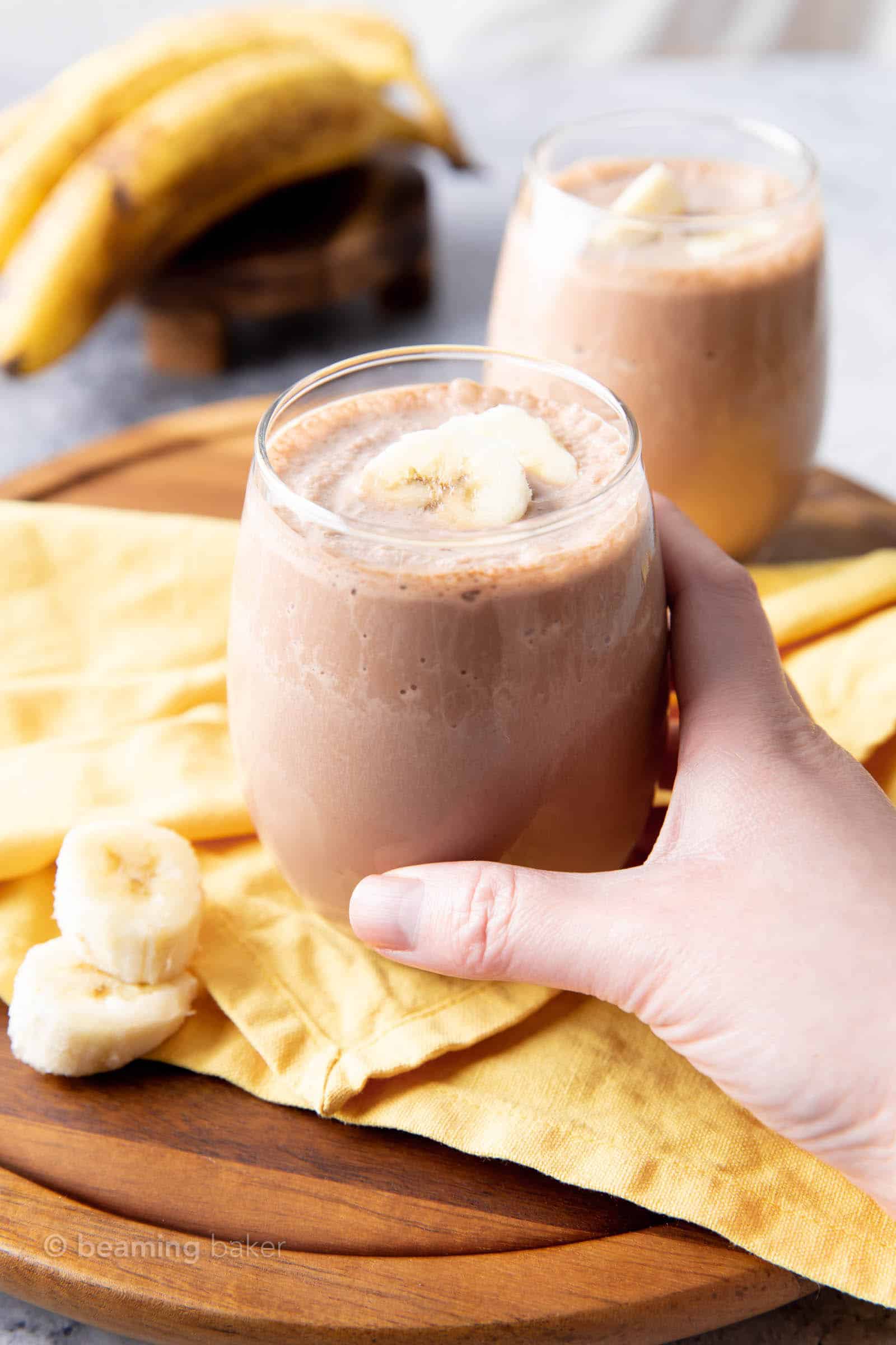 Chocolate Banana Vegan Protein Shake Recipe: creamy ‘n delicious chocolate banana protein shake made with just 4 ingredients. 22 grams of plant-based protein in the best vegan protein shake recipe! #Vegan #Chocolate #Banana #Protein #Shake | Recipe at BeamingBaker.com