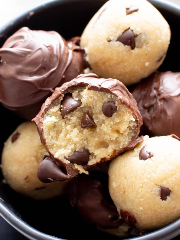 Healthy Cookie Dough Truffles: the ultimate healthy edible cookie dough recipe yields rich ‘n satisfying healthy cookie dough bites wrapped in velvety chocolate. #Healthy #CookieDough #Edible | Recipe at BeamingBaker.com