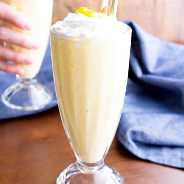 Mango Vegan Milkshake: this 3 ingredient vegan milkshake recipe is thick ‘n creamy with delicious mango coconut flavor. The easiest homemade vegan milkshake! #Vegan #Milkshake #Mango | Recipe at BeamingBaker.com