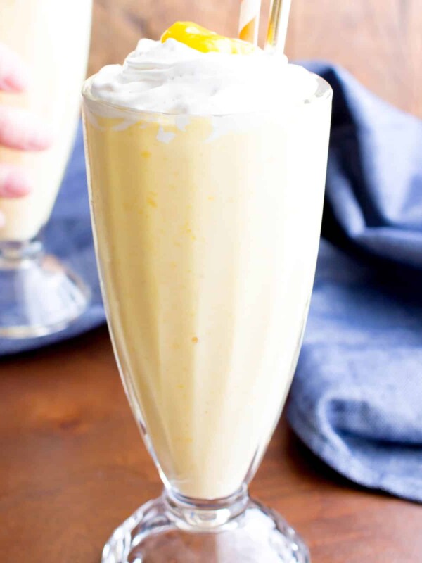 Mango Vegan Milkshake: this 3 ingredient vegan milkshake recipe is thick ‘n creamy with delicious mango coconut flavor. The easiest homemade vegan milkshake! #Vegan #Milkshake #Mango | Recipe at BeamingBaker.com