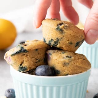 Mini Vegan Lemon Blueberry Muffins: super cute, mini-sized moist vegan lemon blueberry muffins. Bright blueberry & fresh lemon flavor packed into tiny vegan muffins! #Vegan #Lemon #Blueberry #Muffins | Recipe at BeamingBaker.com