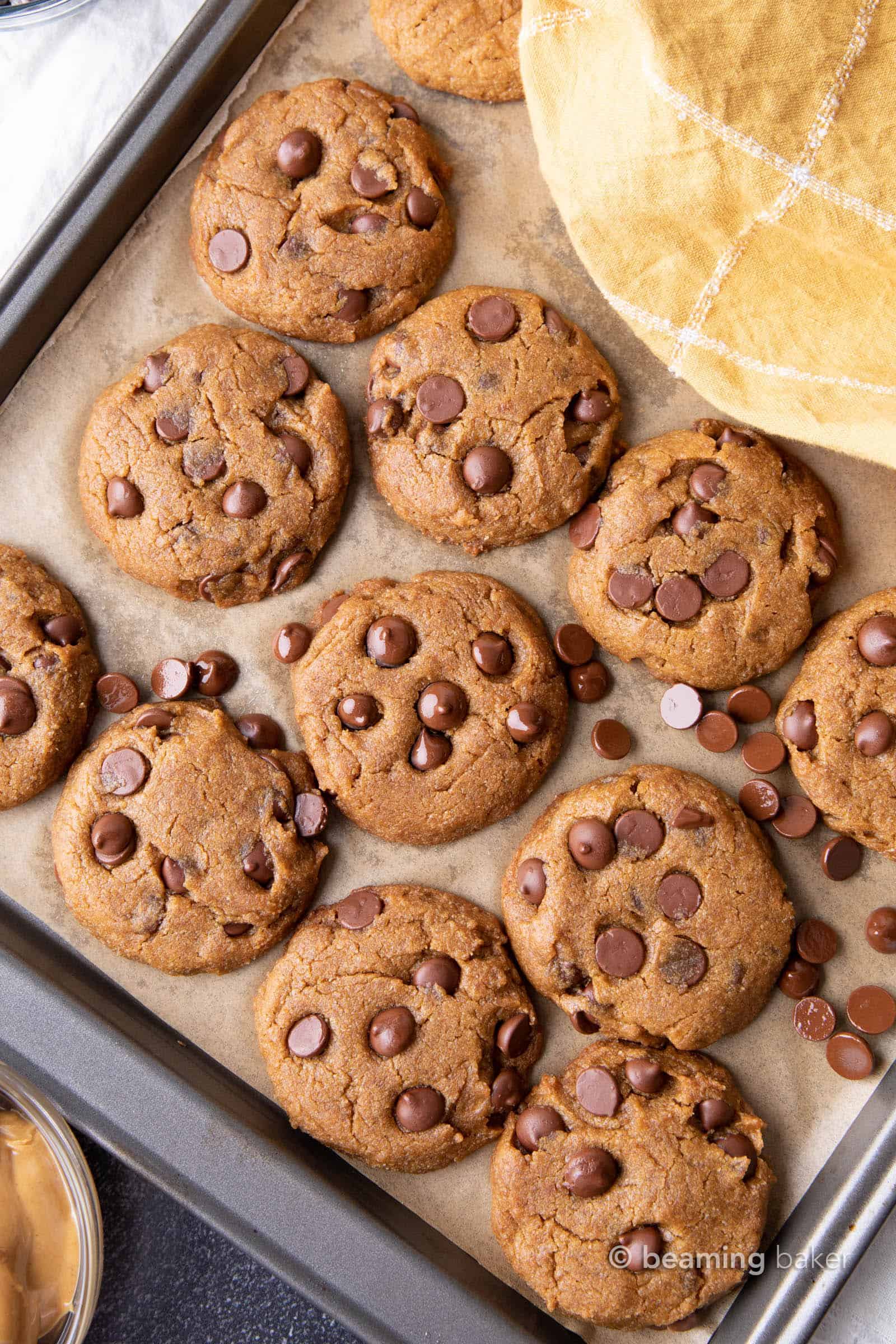 Vegan Peanut Butter Chocolate Chip Cookies: an easy recipe for chewy, moist vegan peanut butter chocolate chip cookies bursting with deep peanut butter flavor. #Vegan #PeanutButter #ChocolateChip #Cookies | Recipe at BeamingBaker.com