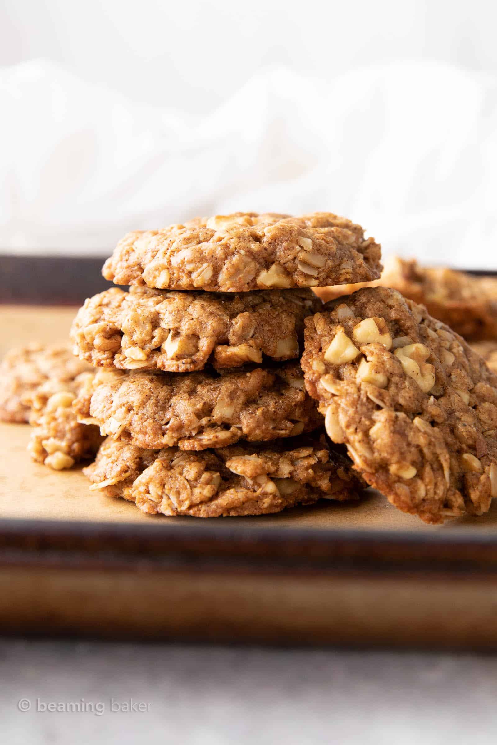 Cinnamon oatmeal cookies stacked with one cookie on the side