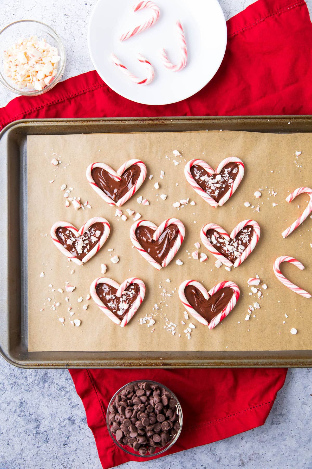 bowls of chocolate chips and candy canes while making Candy cane hearts.