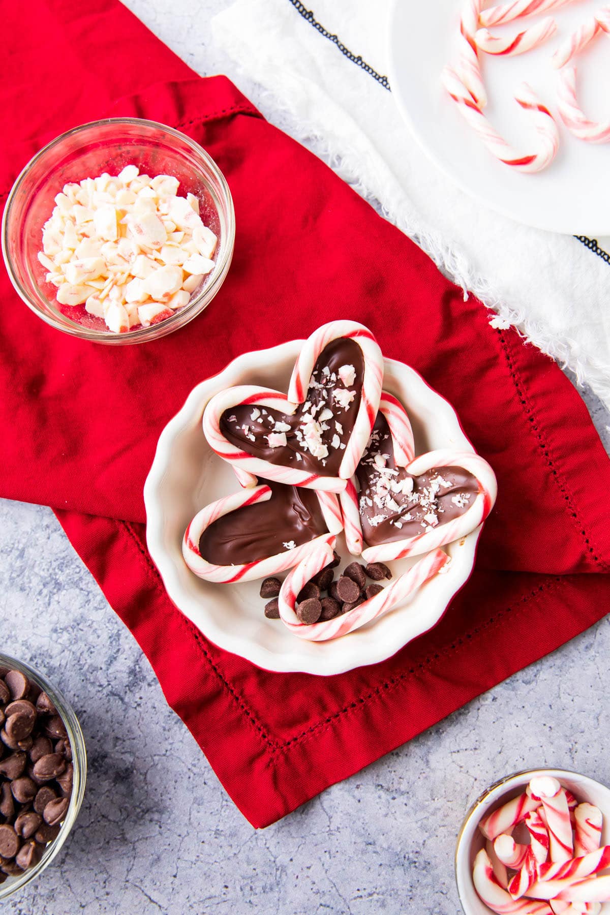 Serving up this festive Christmas sweet treat in a red bowl with crushed candy nearby.