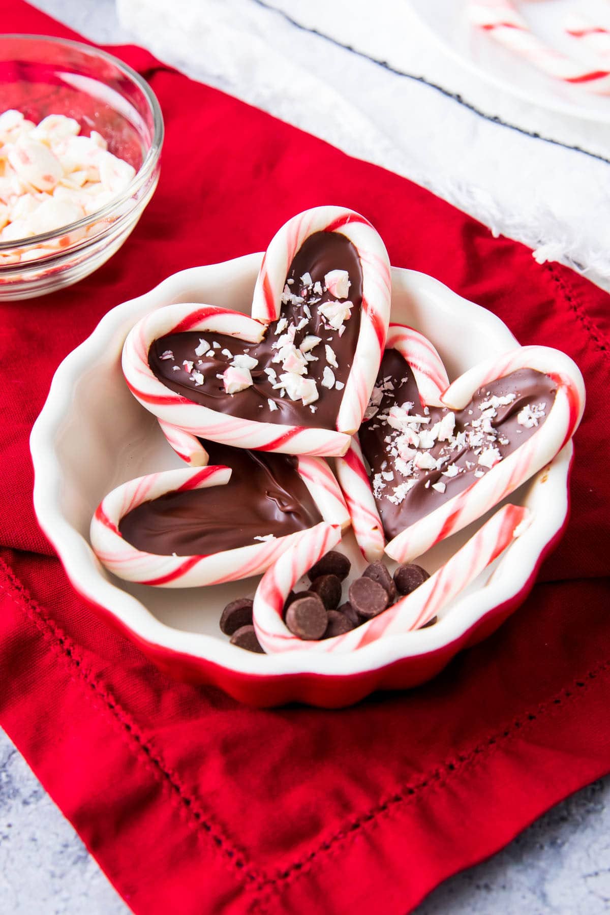 Candy cane hearts including two mini candy canes with a chocolate center topped with crushed candy canes.