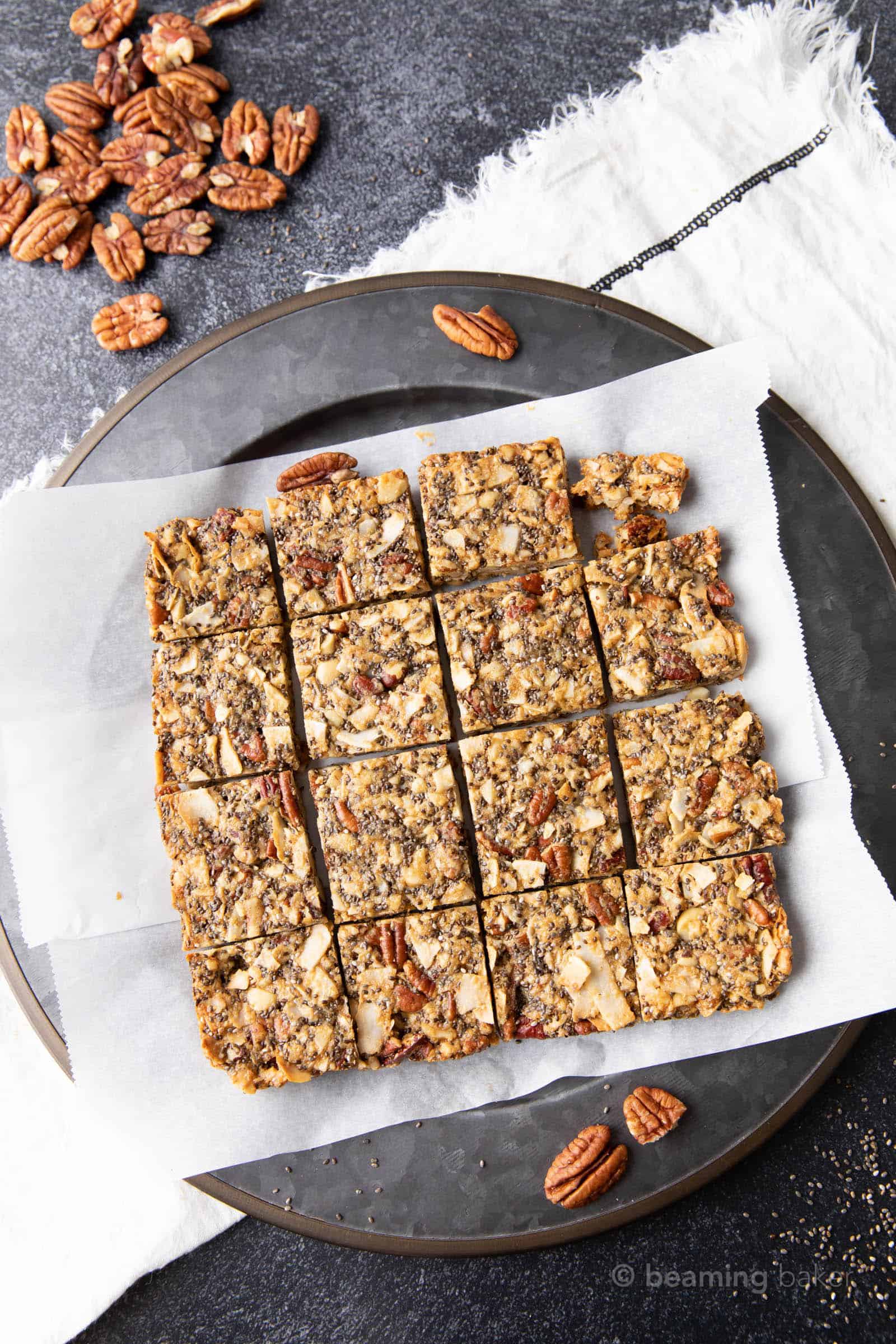 A stack of keto granola bars on parchment paper