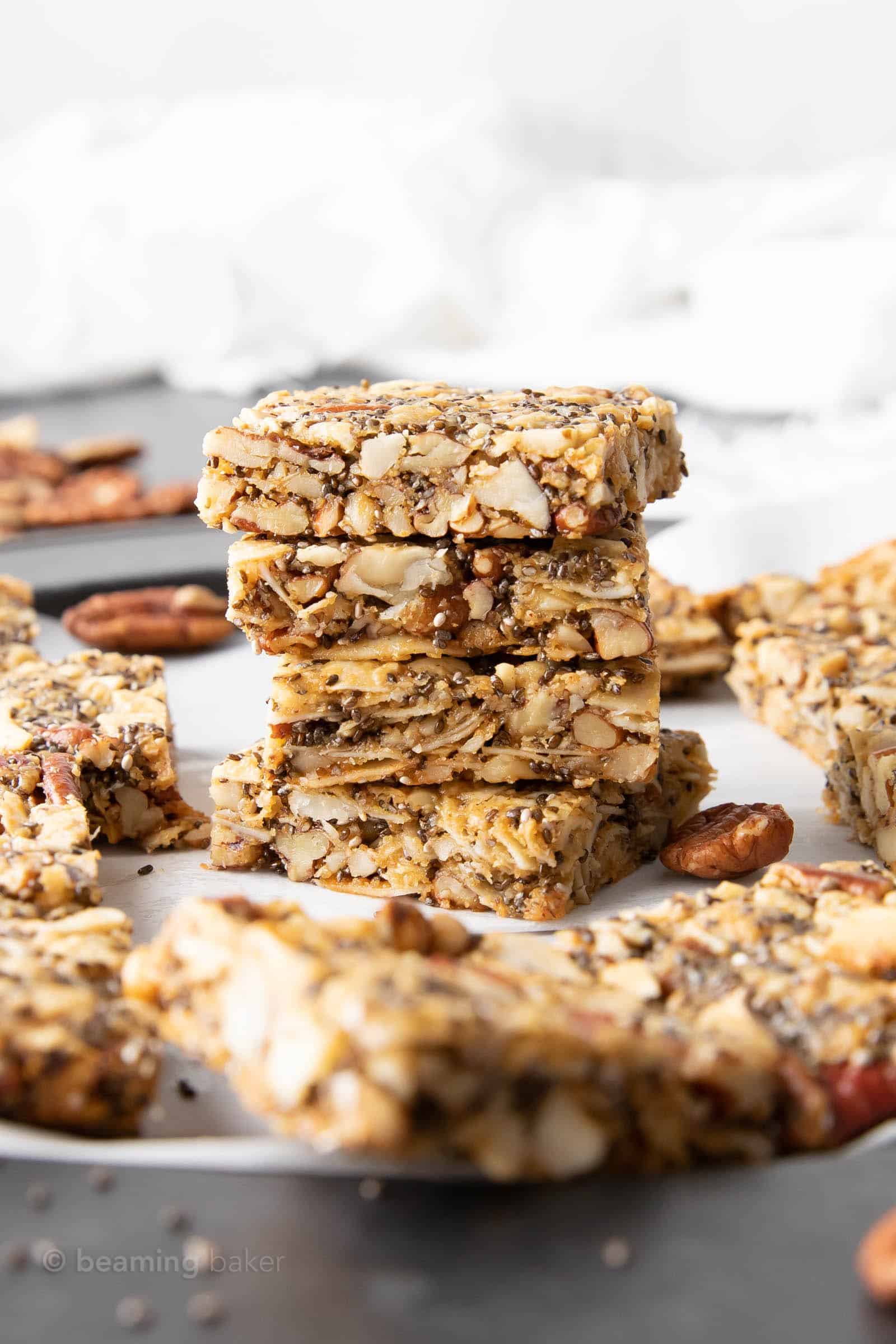 keto granola bars in a stack near more granola bars