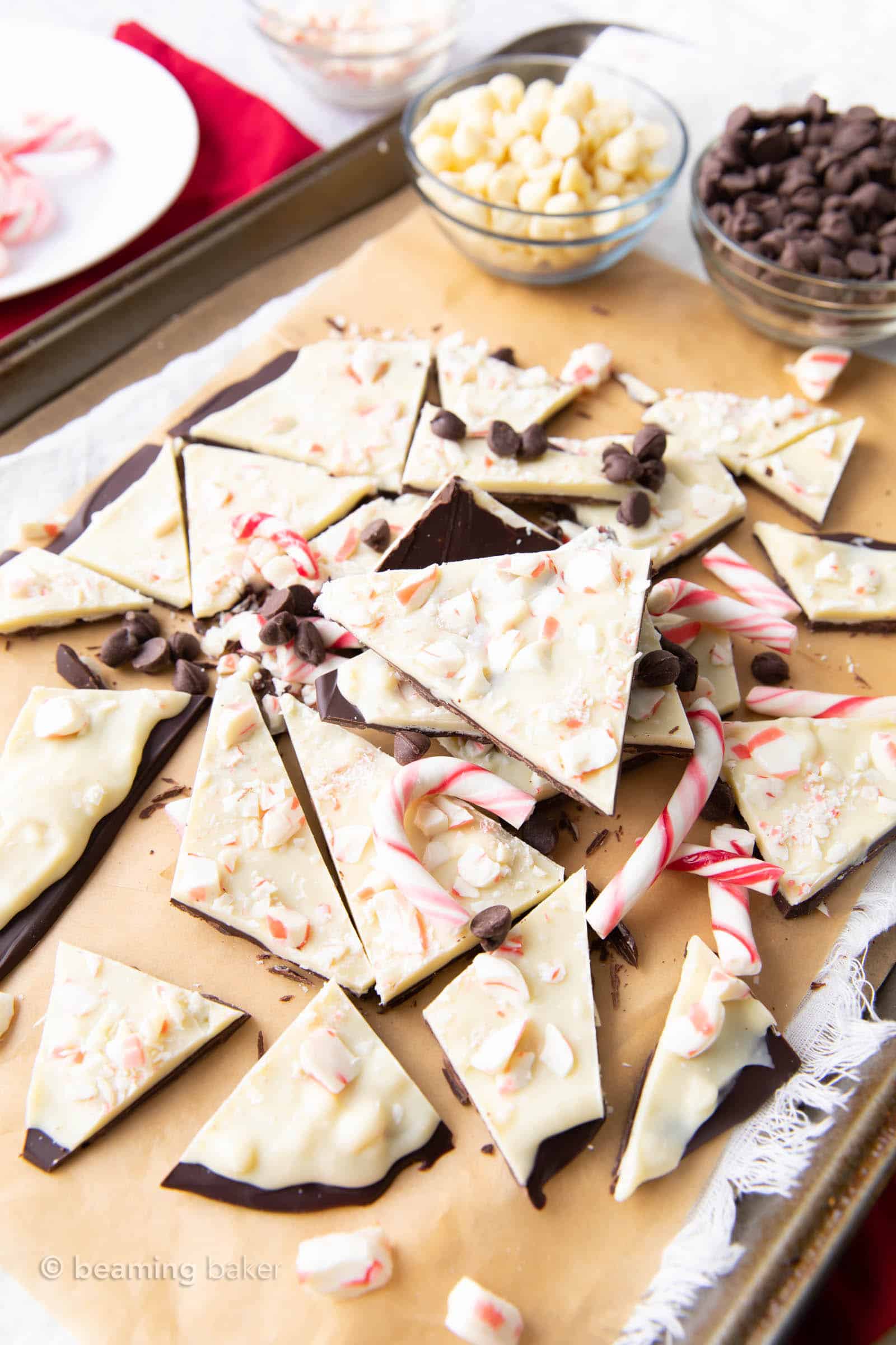Angled faraway shot of a stack of keto friendly peppermint bark with candy canes