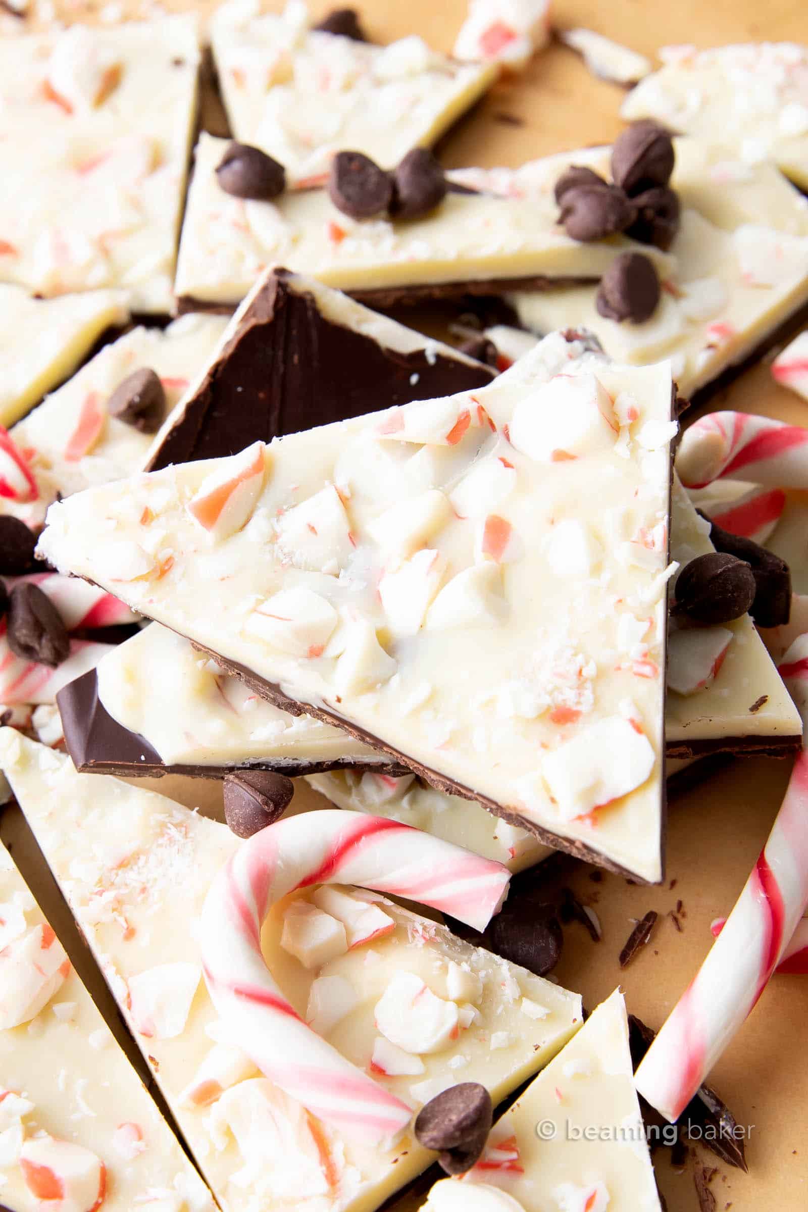 super closeup of stack of keto peppermint bark with keto chocolate chips and keto peppermint candy