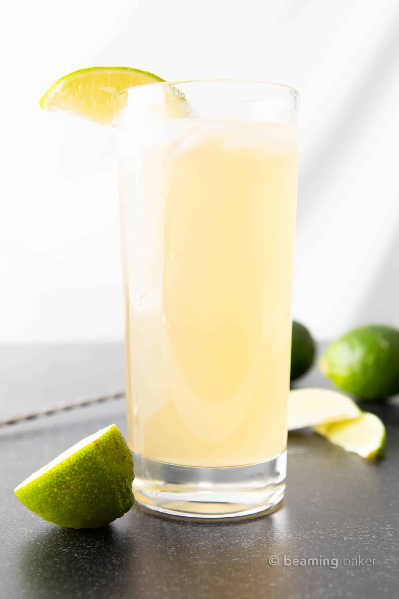 Highball glass filled with Tennessee mule cocktail, garnished with lime wedge