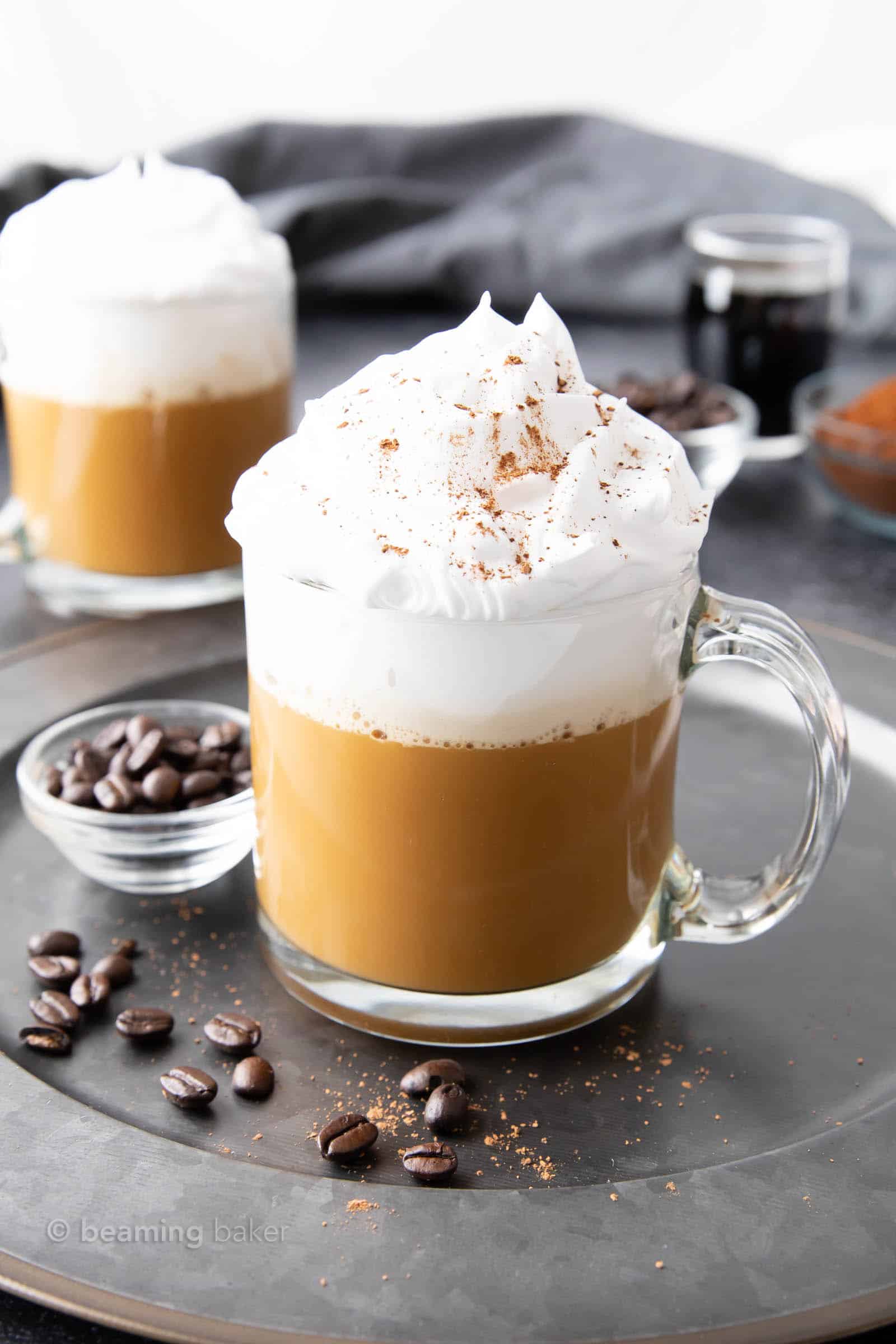 piping hot white russian in a glass with coffee beans