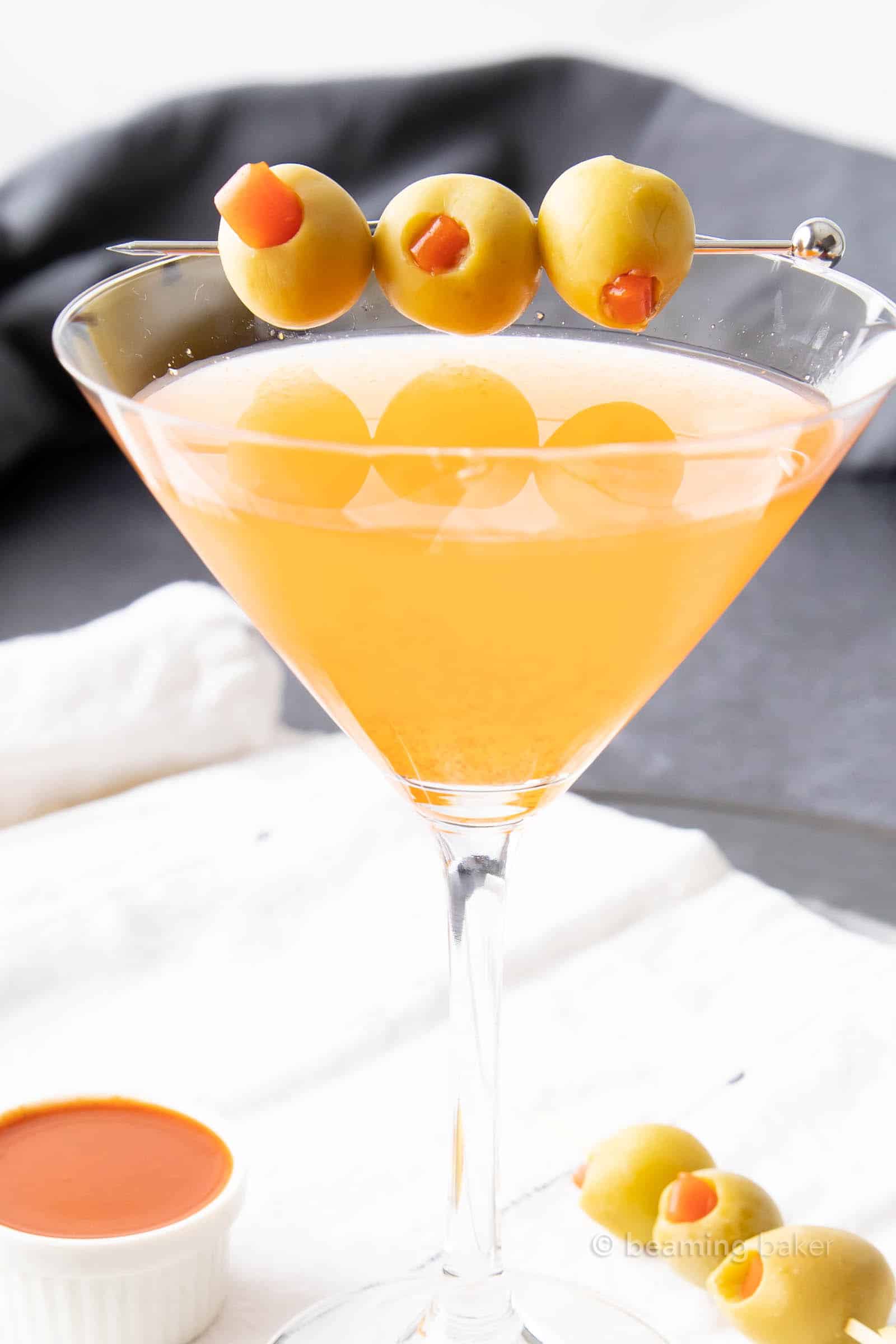 Super closeup shot of hot and dirty martini in a martini glass