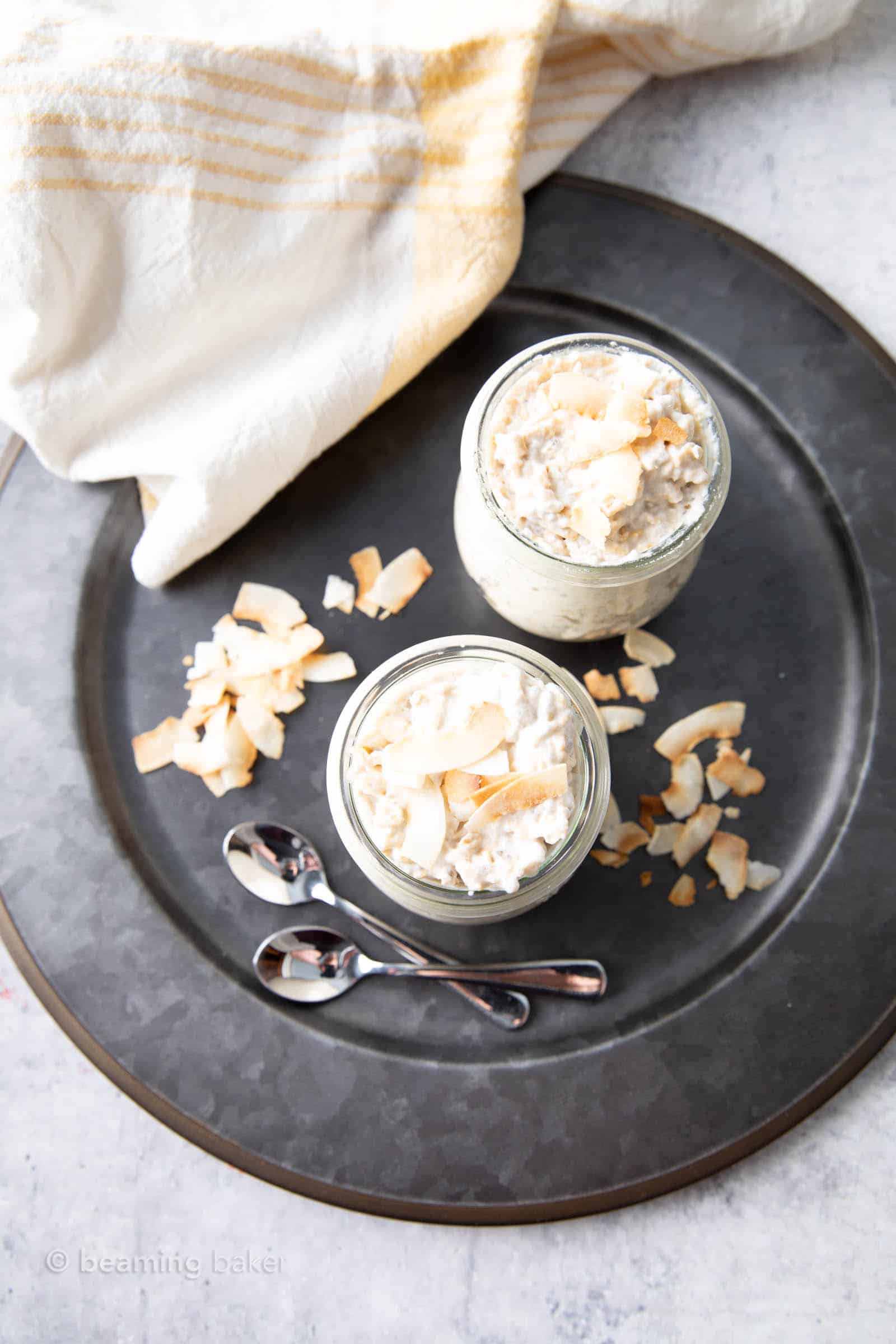 overhead view of coconut overnight oats on a serving tray with toasted coconut bits
