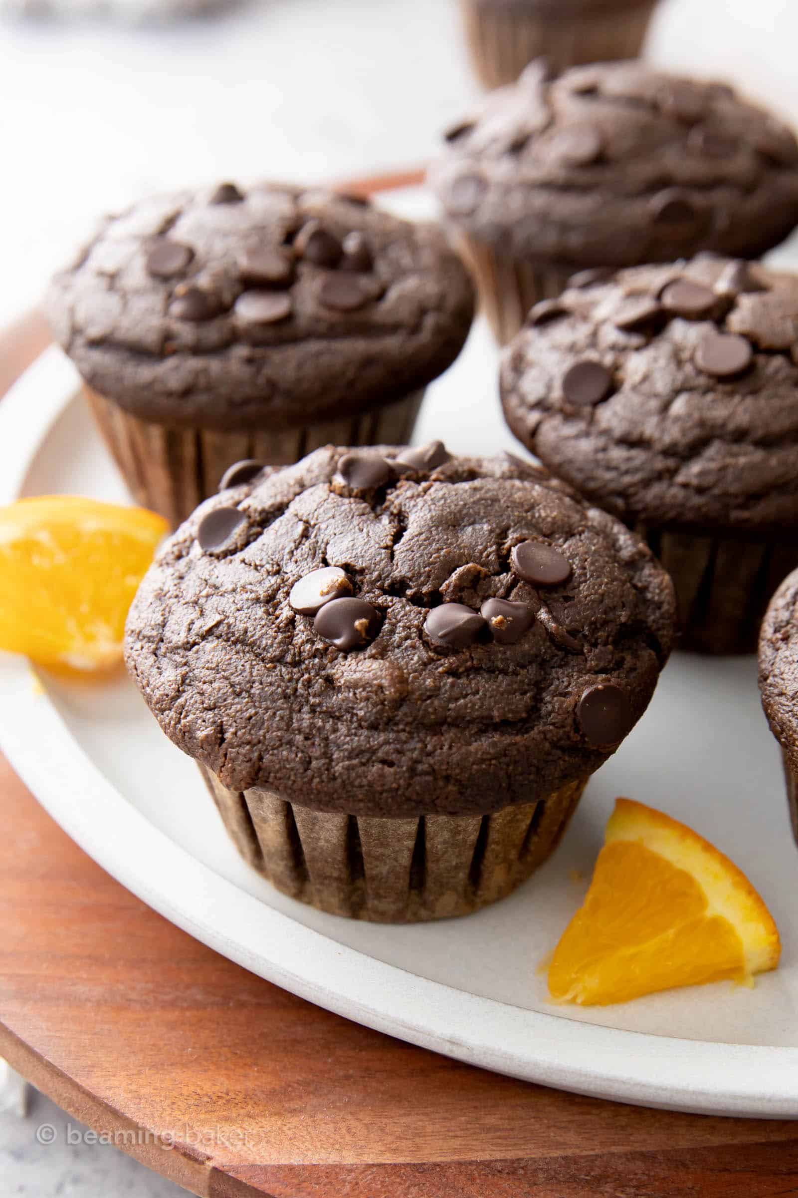Closeup shot of chocolate orange muffins arranged on a gray plate