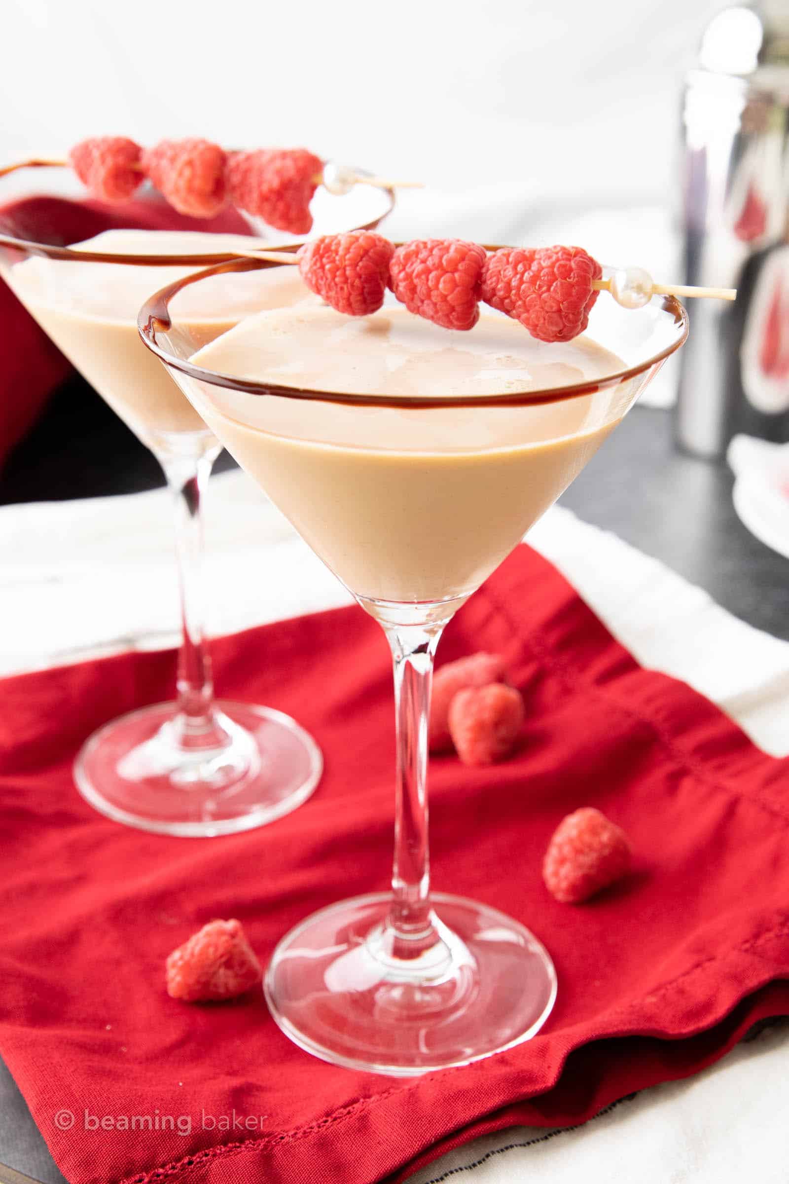 two chocolate raspberry martinis in chocolate rimmed glasses