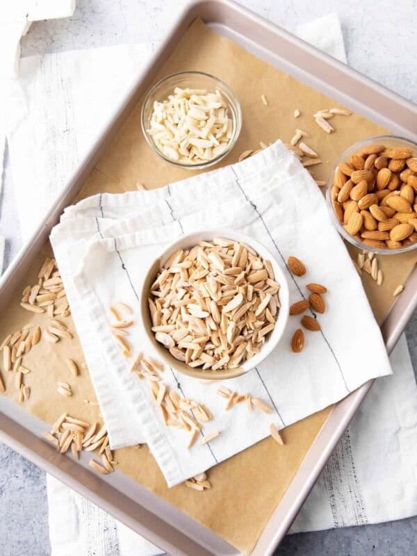 closeup of how to toast slivered almonds in a bowl