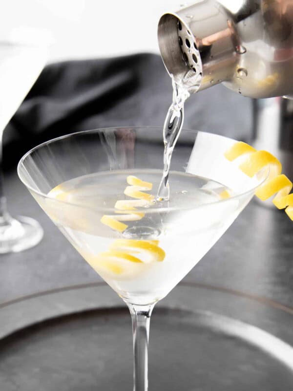 Closeup pour of classic martini into martini glass