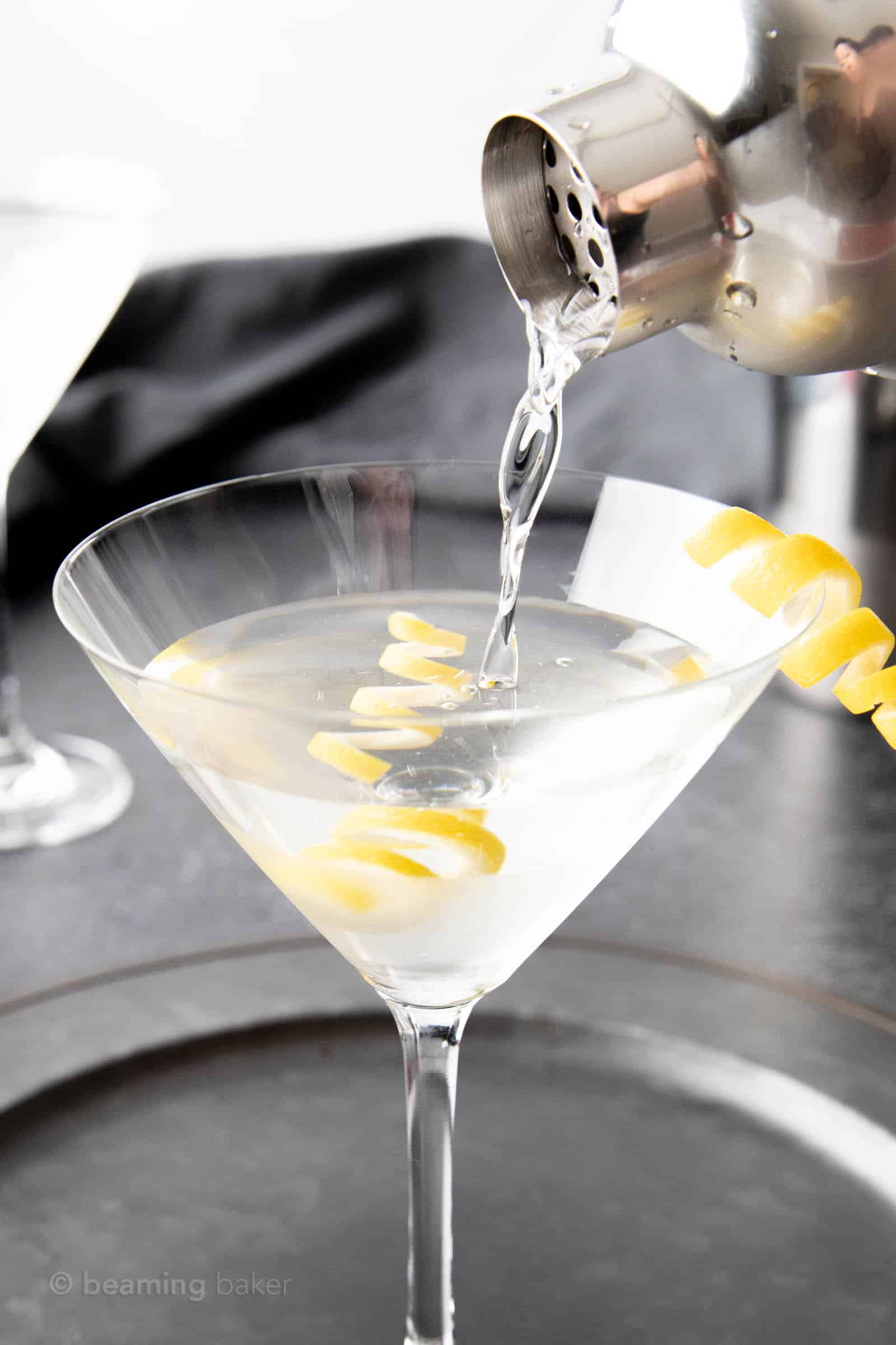 Closeup pour of classic martini into martini glass