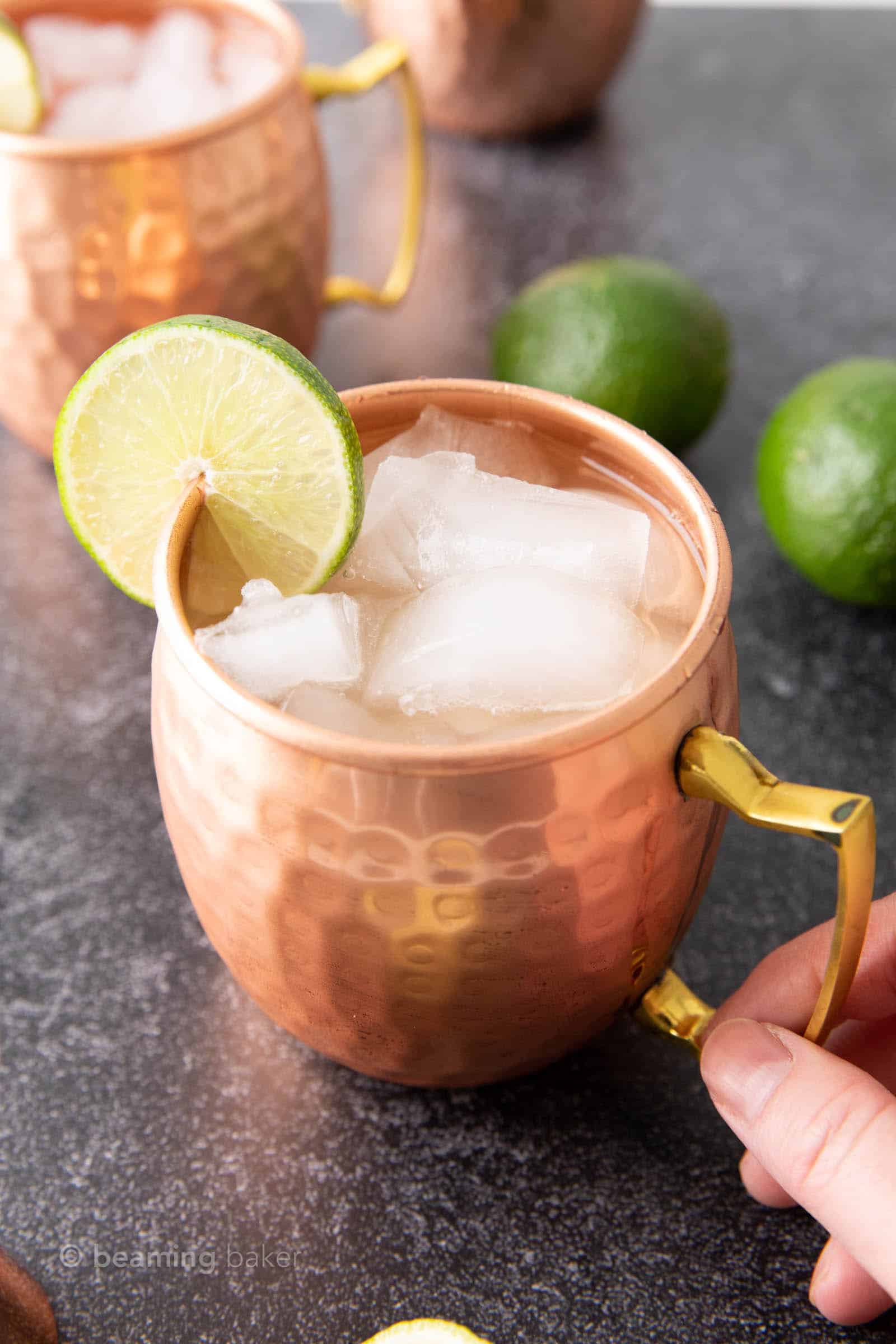 Irish Mule recipe served with ice with a hand holding the mug