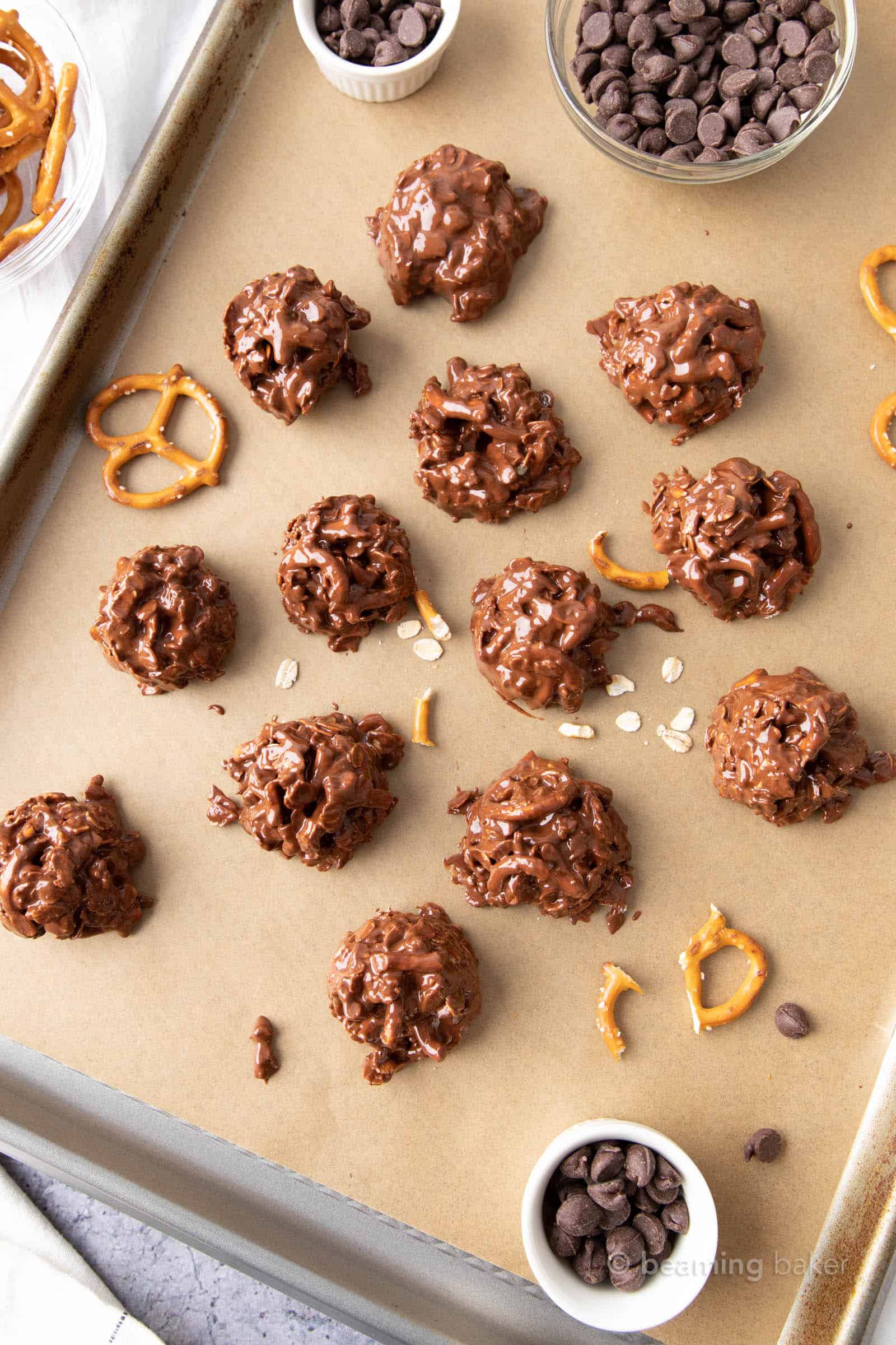 melted chocolate no bake peanut butter cookies on parchment covered baking sheet