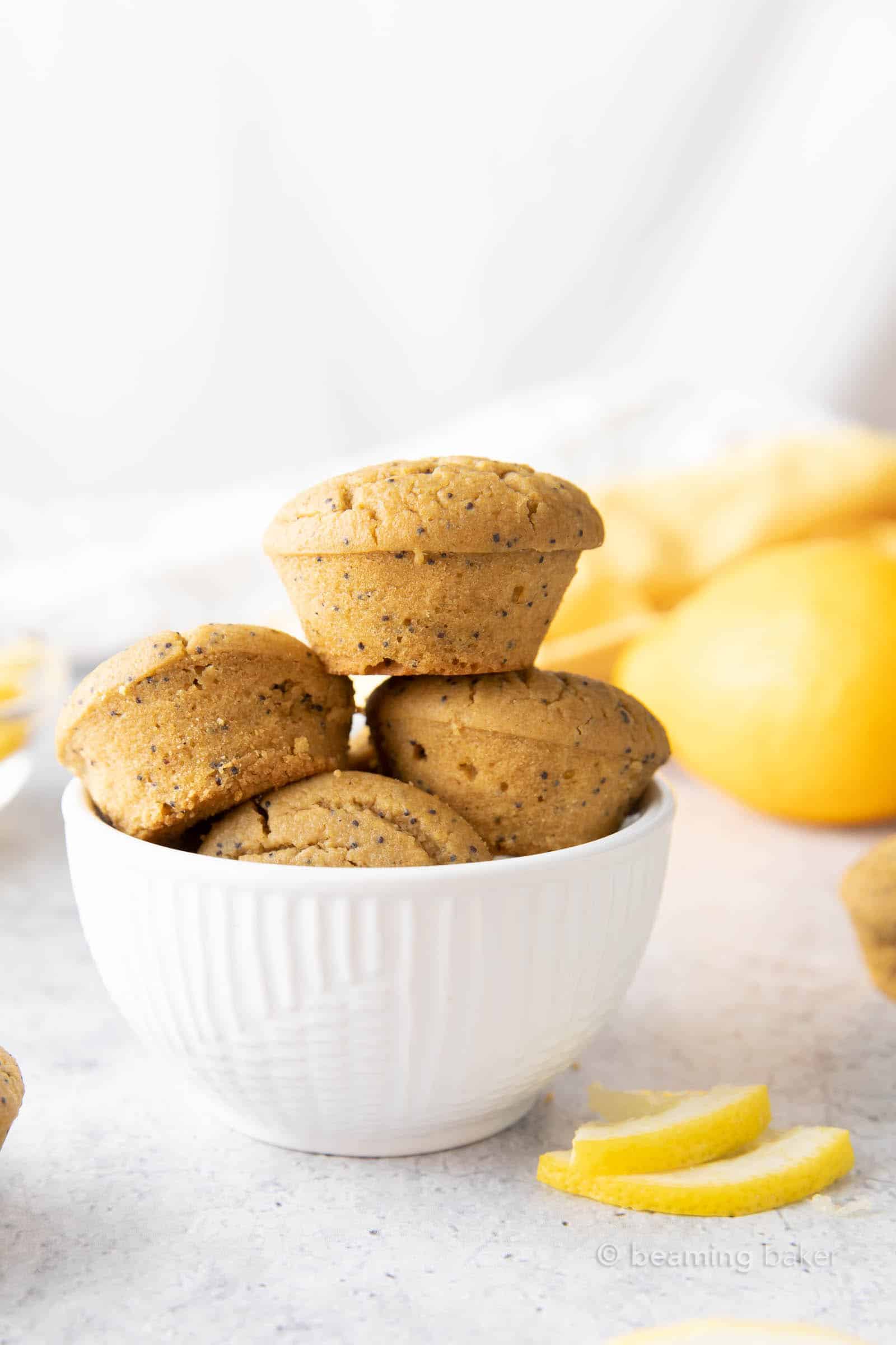 off to the side bowl of lemon poppy seed mini muffins