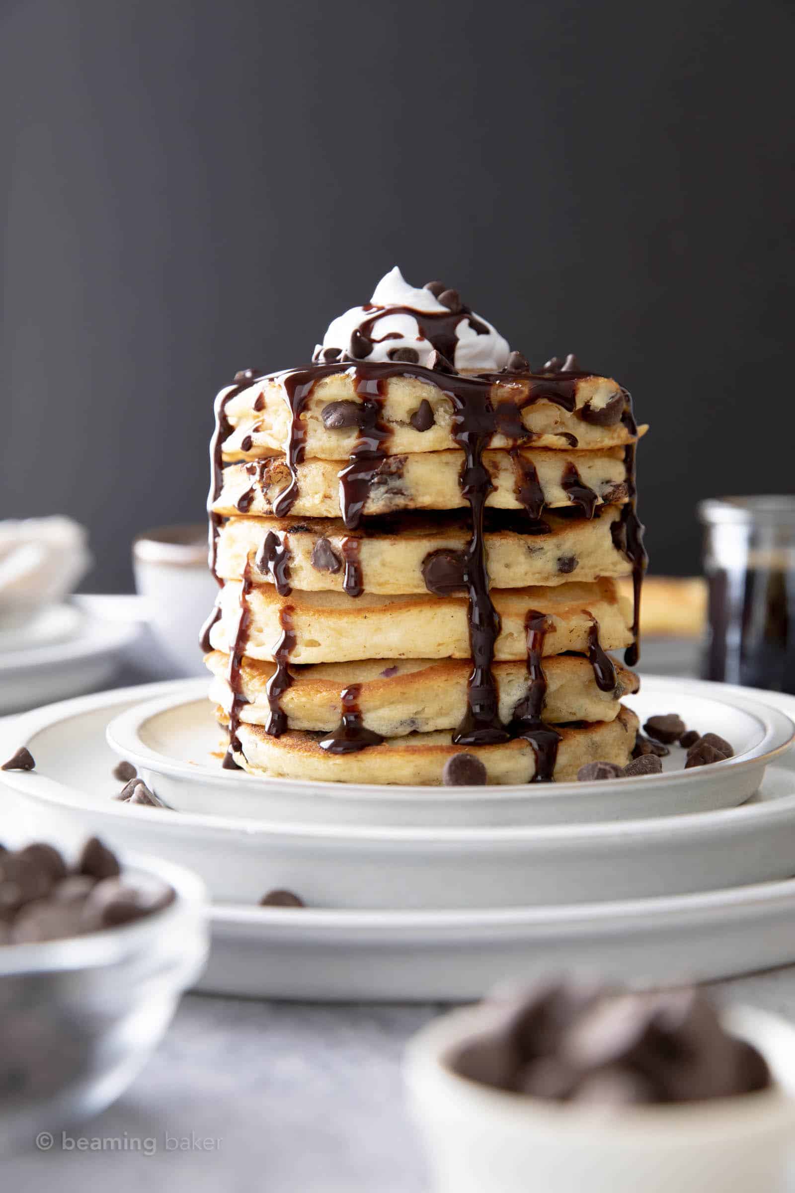 Warm plate of chocolate chip vegan panckes on the breakfast table