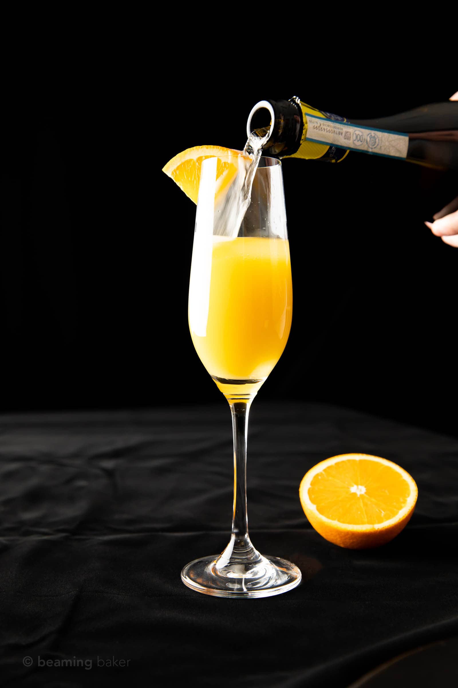 full shot of champagne being poured into a glass