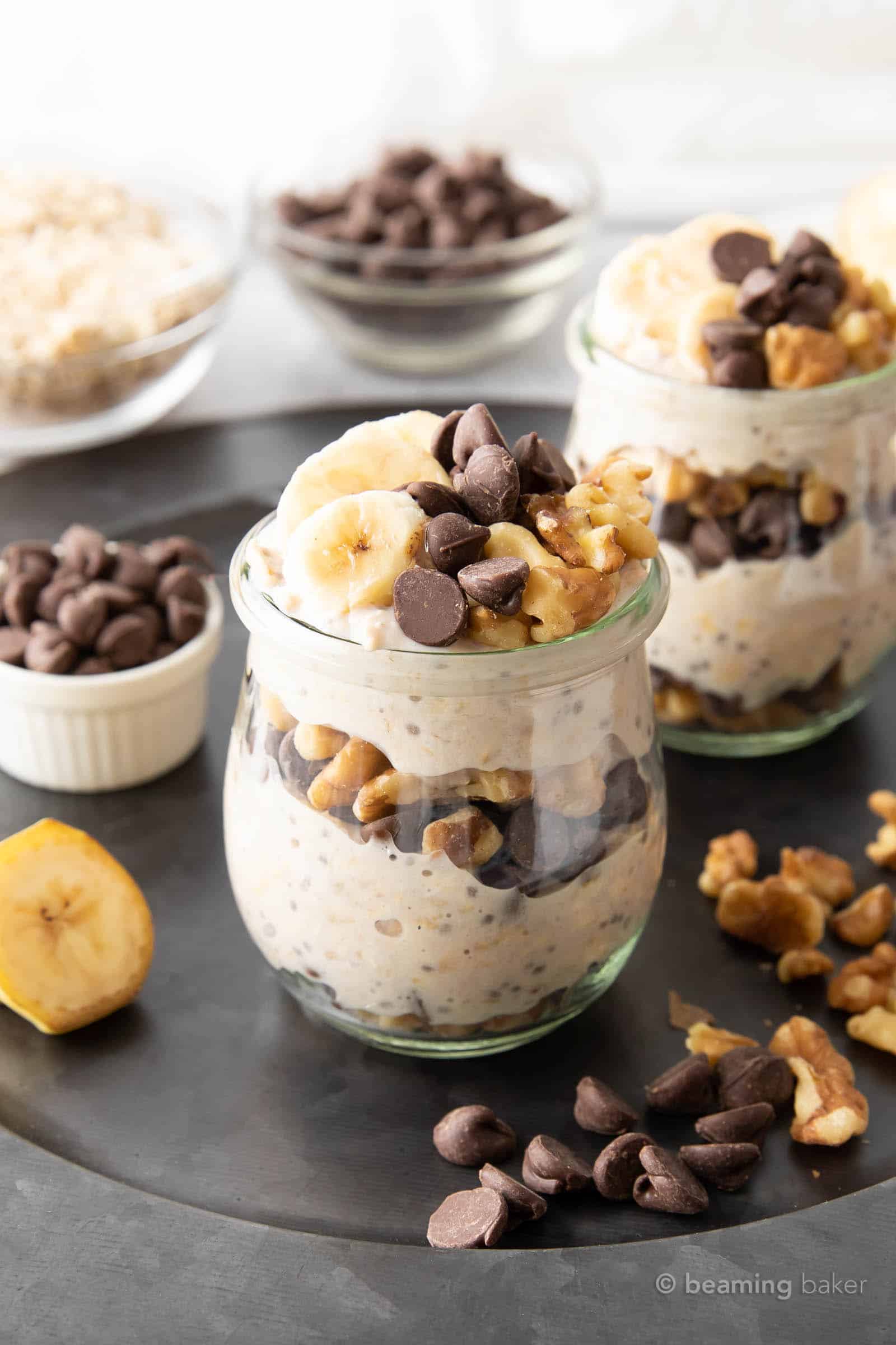 angled view of chunky monkey overnight oats on a grey serving tray