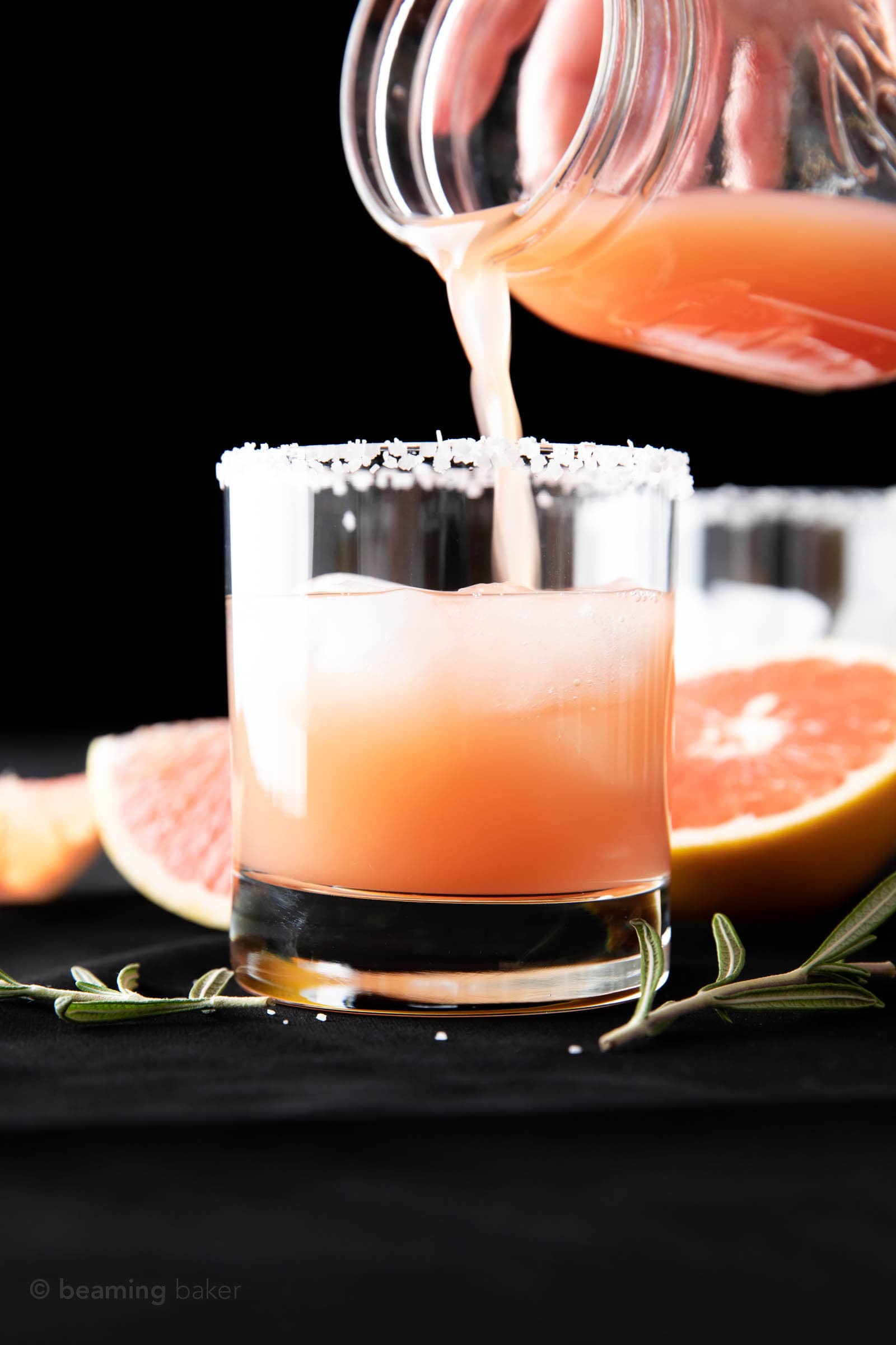 pouring the rest of the gin and grapefruit cocktail mixture