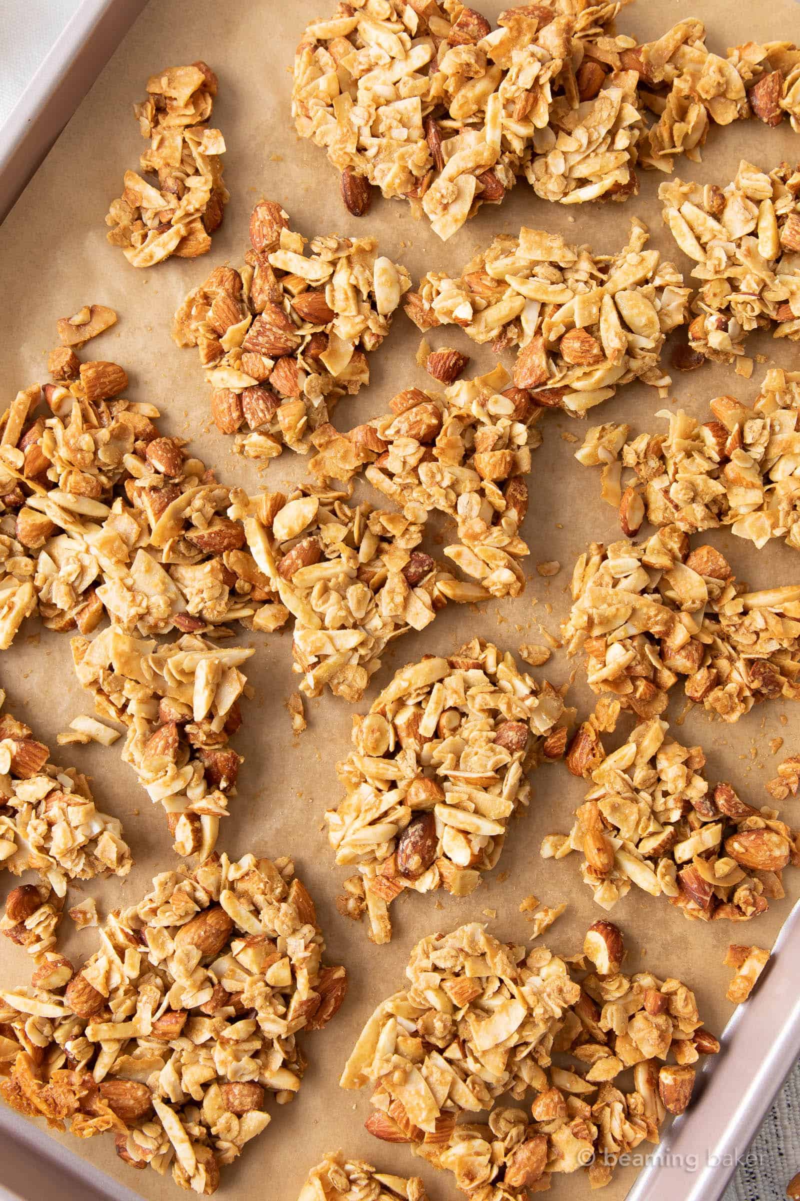 baking sheet full of large clusters for vanilla almont granola recipe