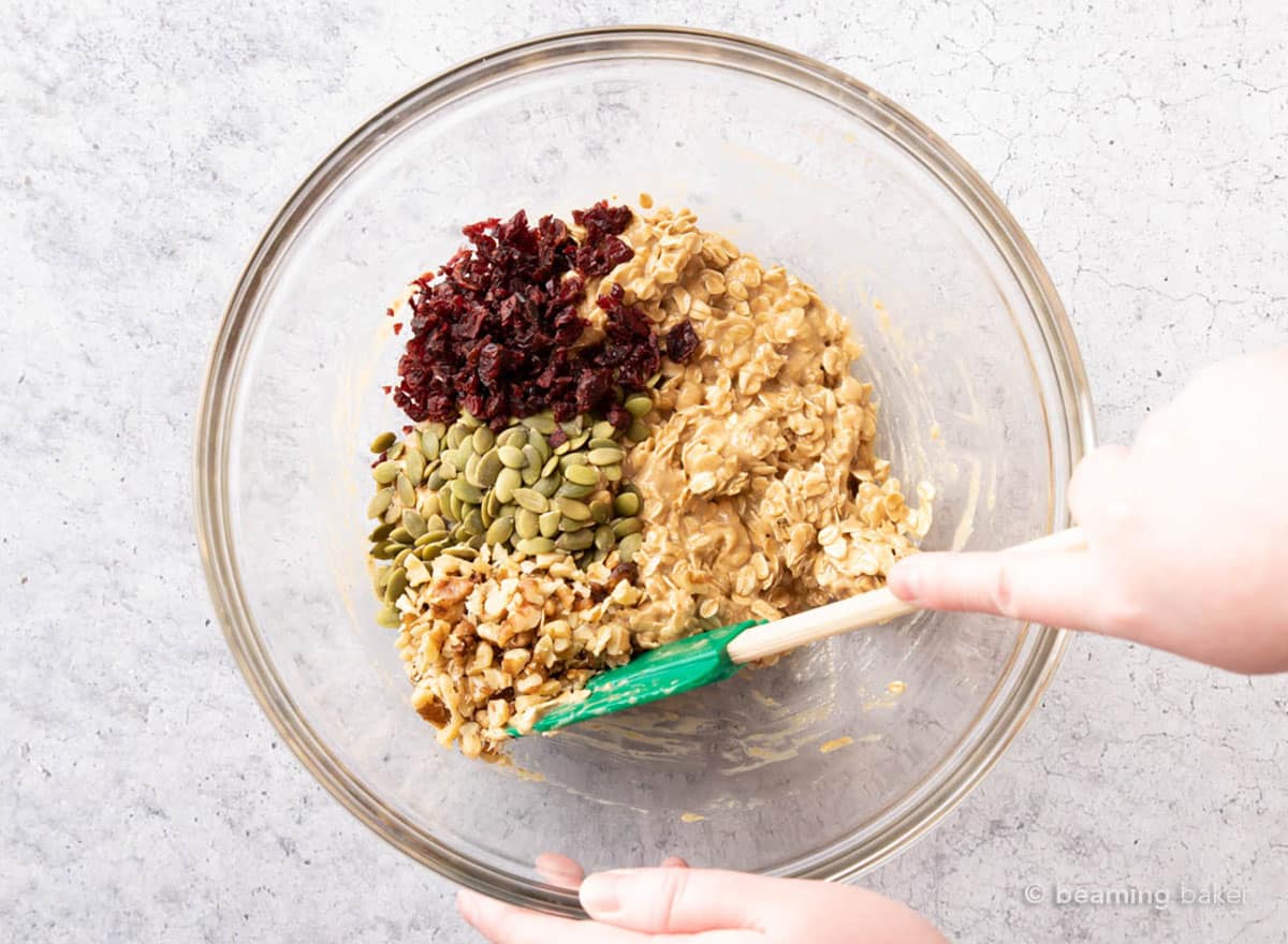 hand mixing add-ins ingredients to breakfast bar mixture