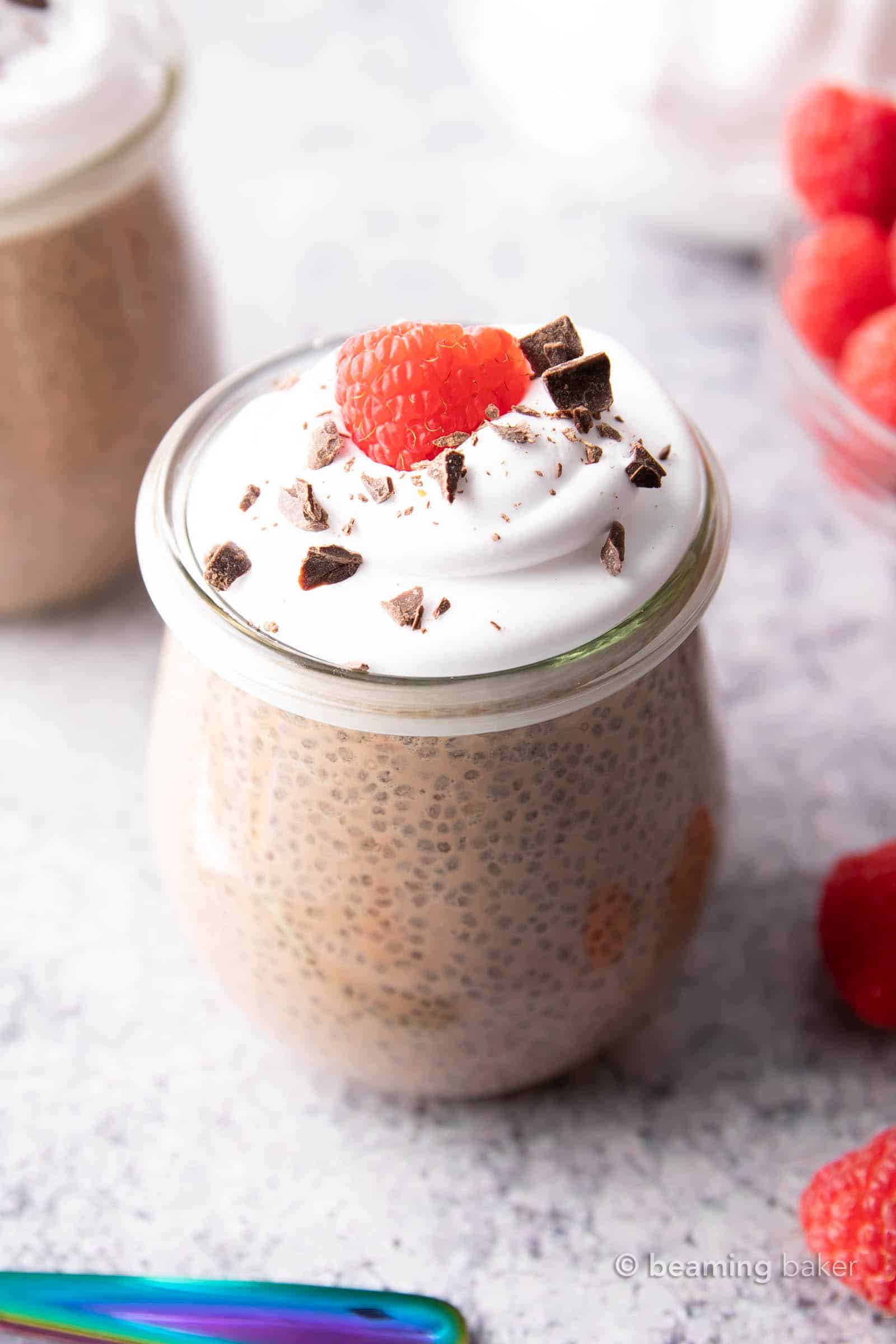 a glass jar filled with chocolate chia pudding