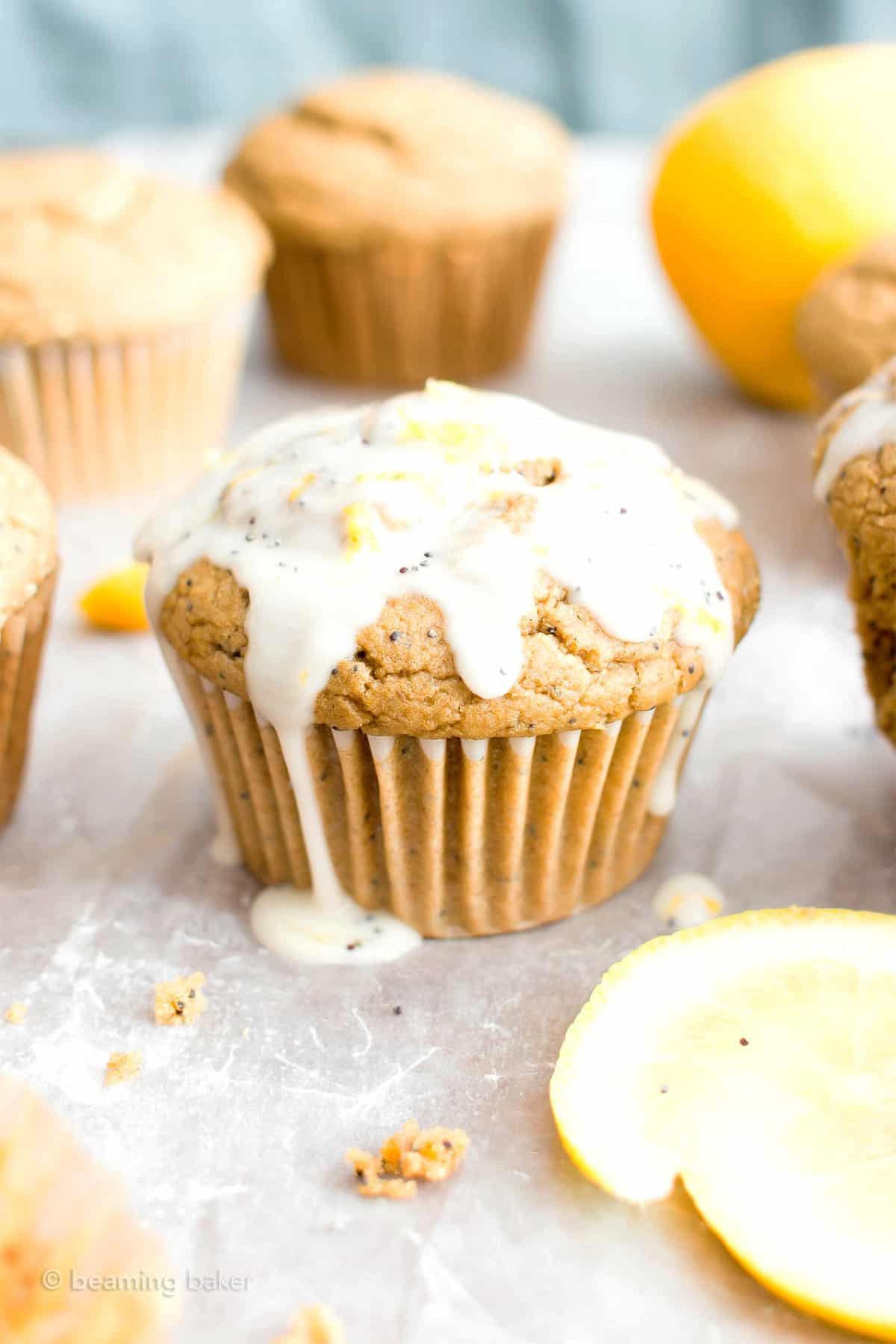 Lemon muffin drenched in lemon glaze and slices of lemon