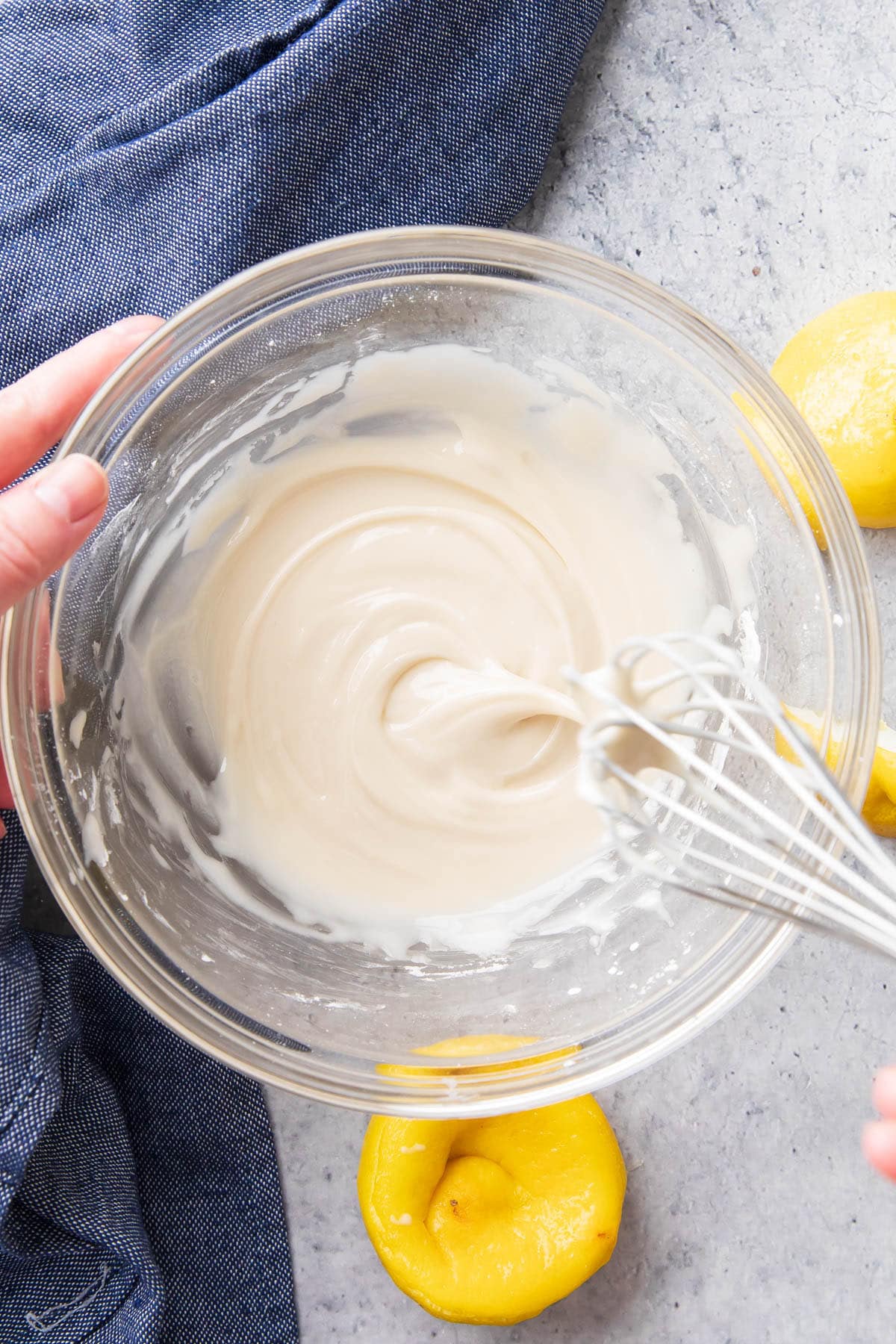 whisking this lemon glaze recipe until thickened enough to show a swirl ribbon